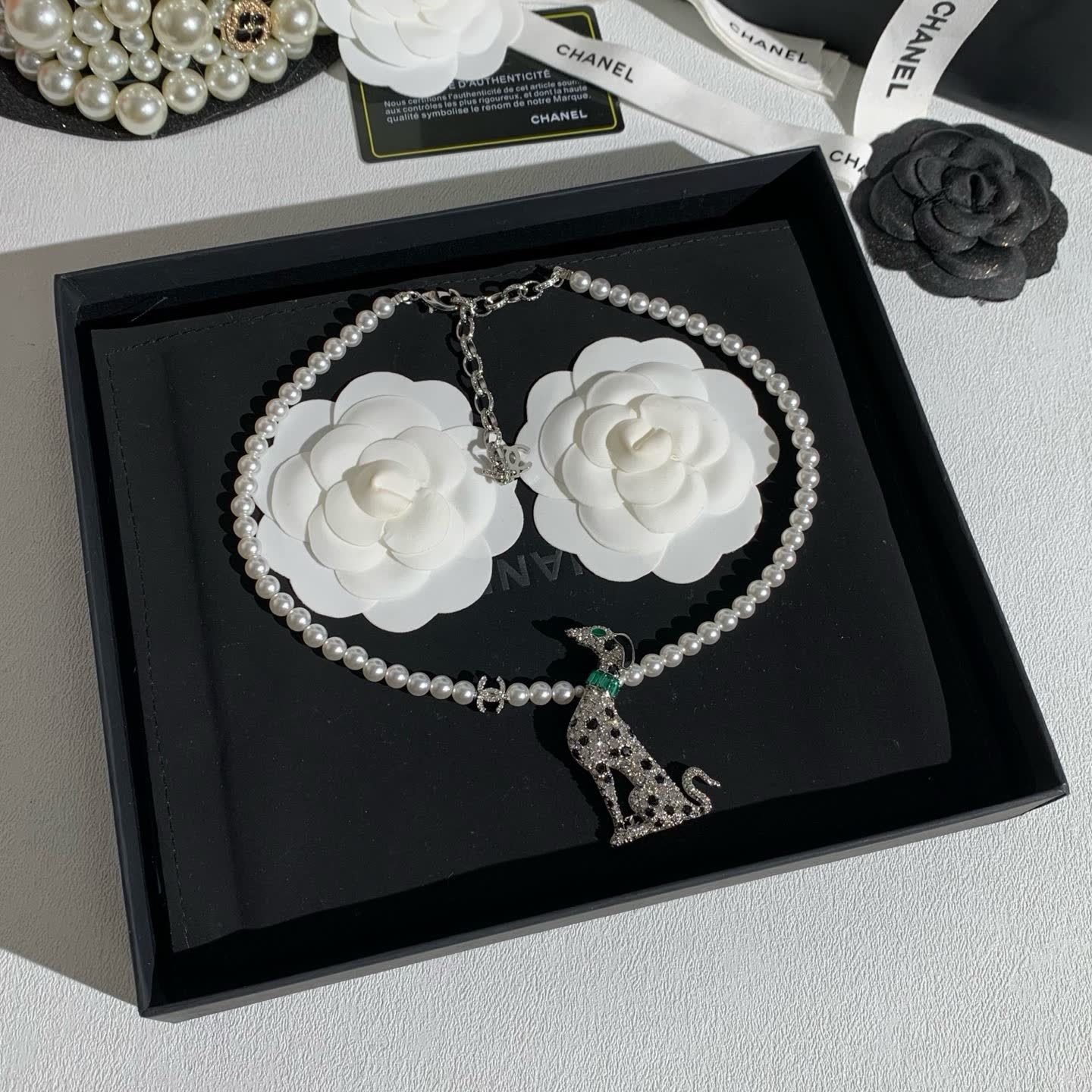 Chanel Elegant White Pearl and Diamond Dog Pendant Necklace