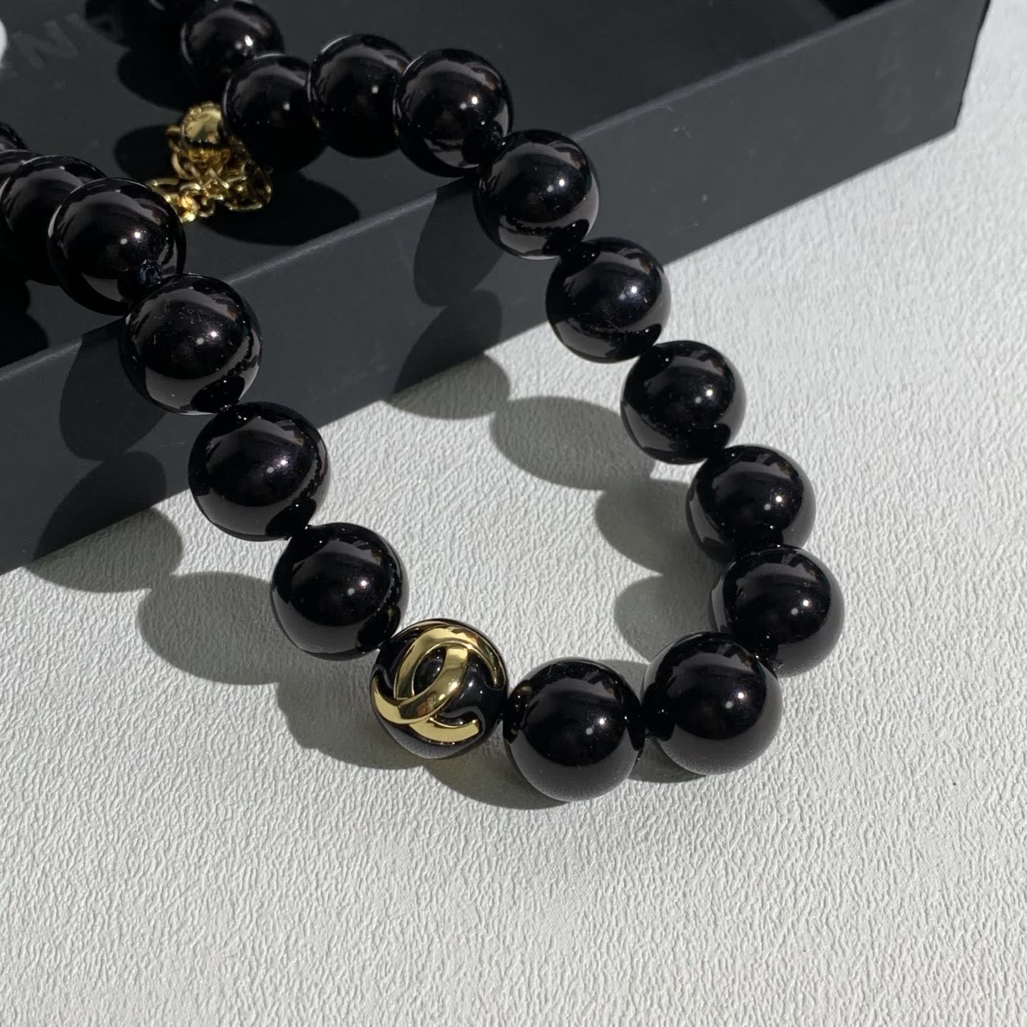Chanel Black Bead Necklace with Gold Logo