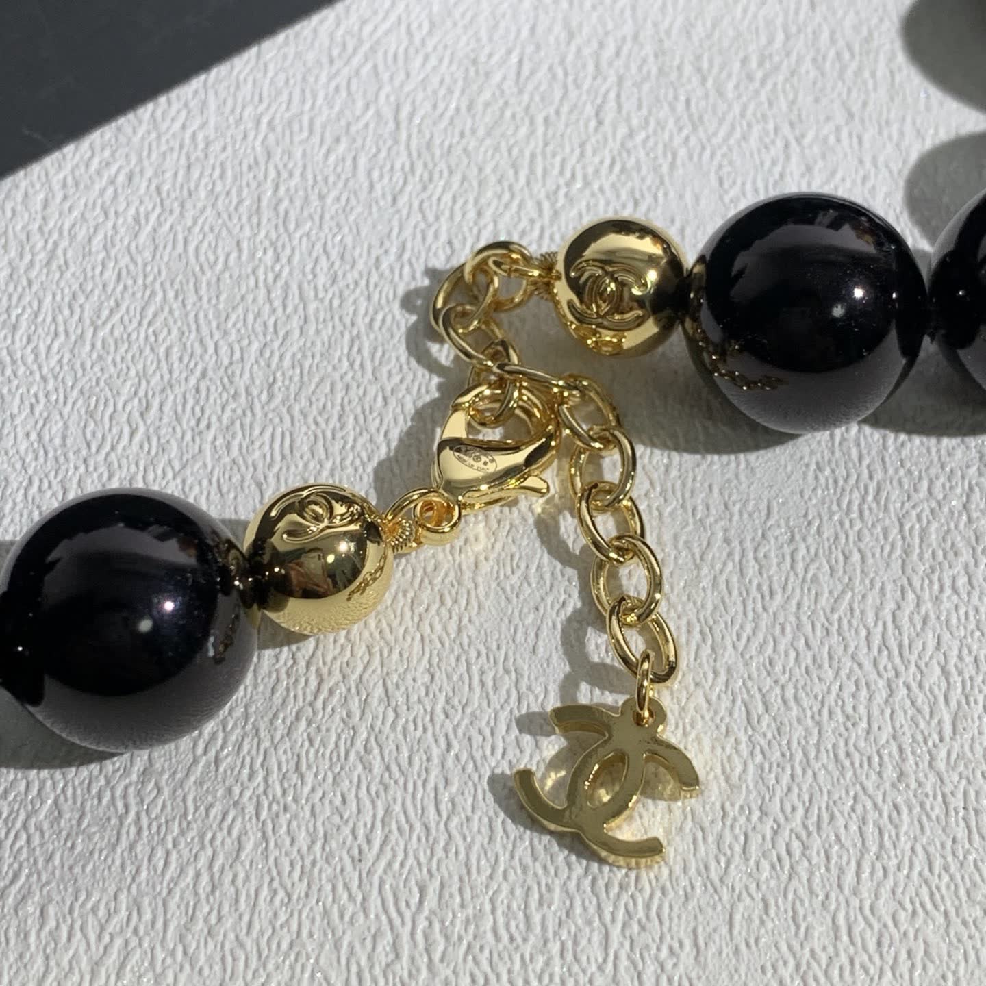 Chanel Black Bead Necklace with Gold Logo