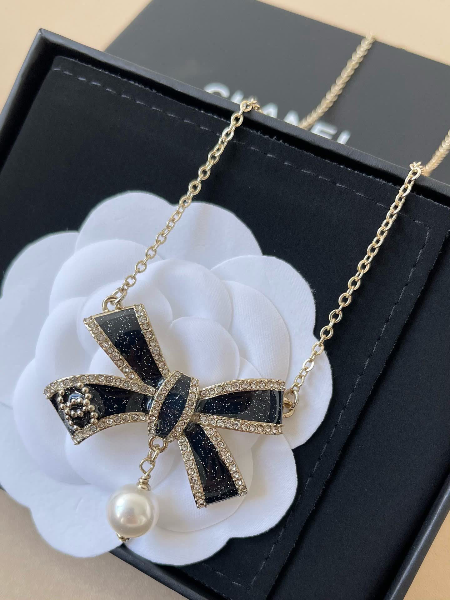 Chanel Black Diamond and Pearl Bow Pendant Necklace
