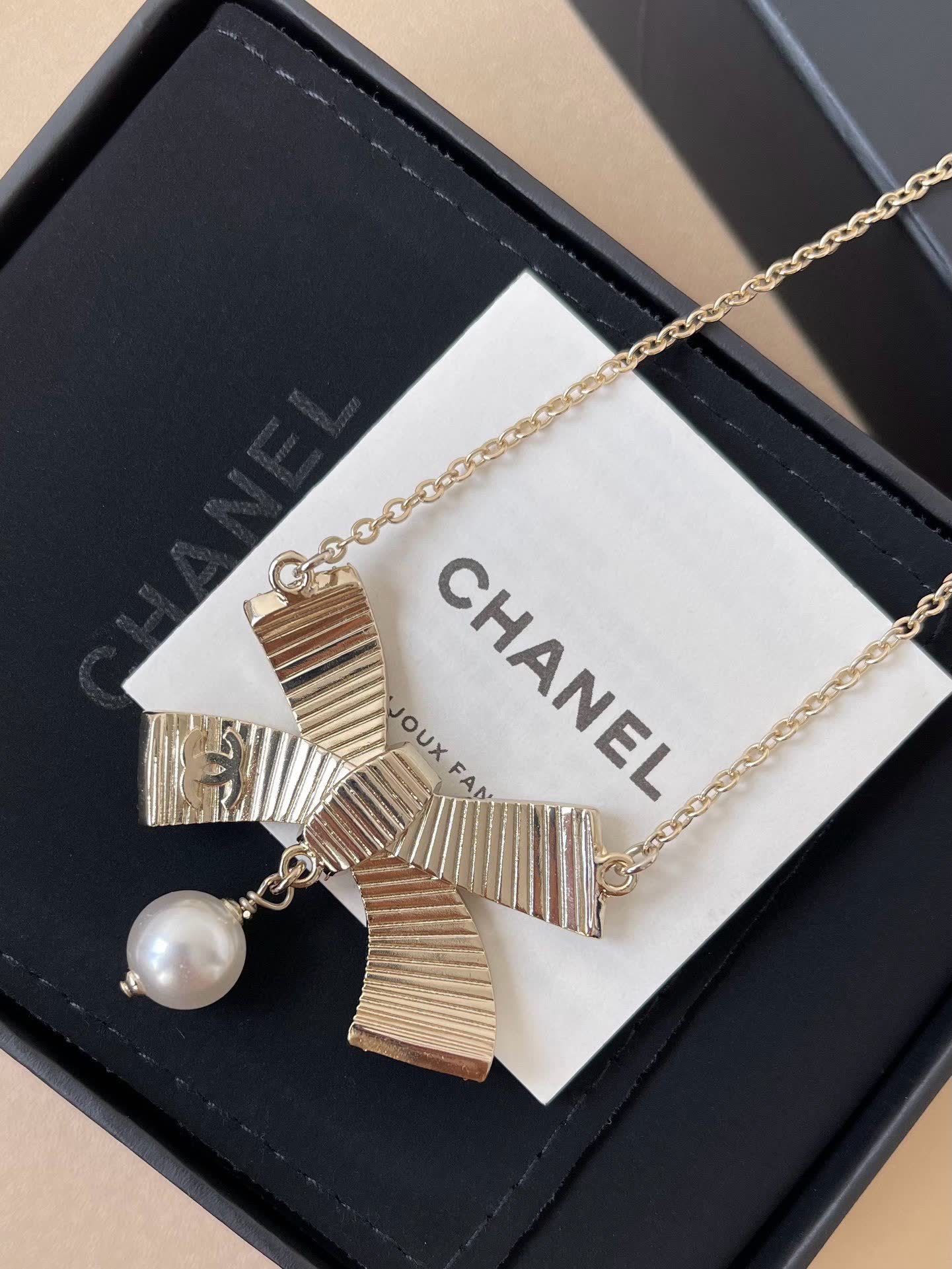 Chanel Black Diamond and Pearl Bow Pendant Necklace