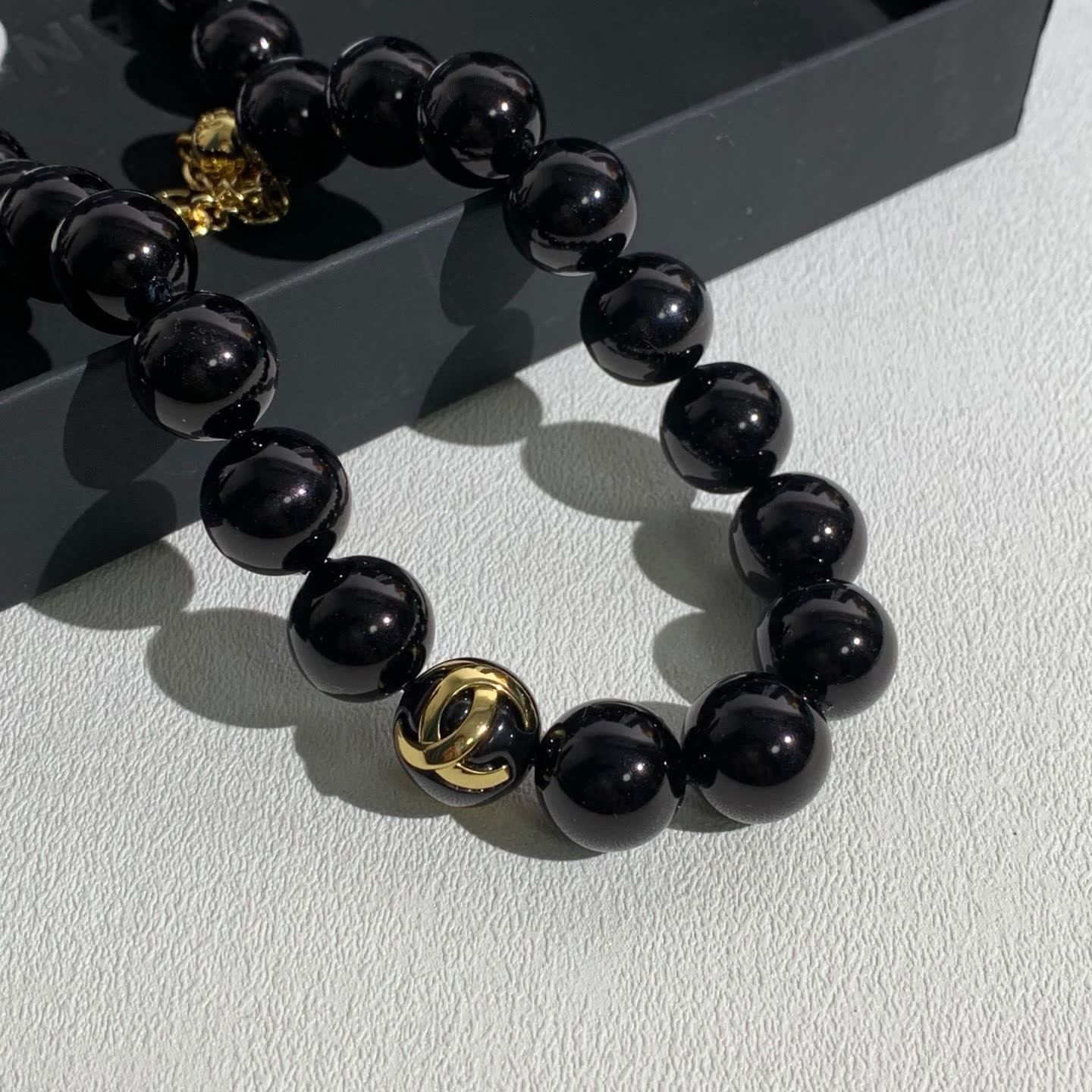 Chanel Black Bead Necklace with Gold Logo
