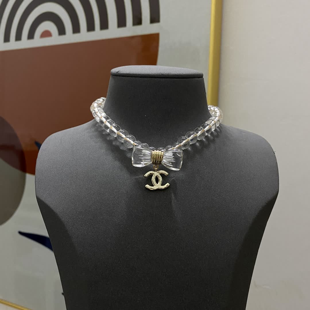 Chanel Crystal Beaded Necklace with Bow and Logo Pendant