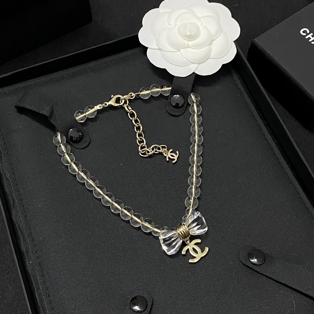 Chanel Crystal Beaded Necklace with Bow and Logo Pendant
