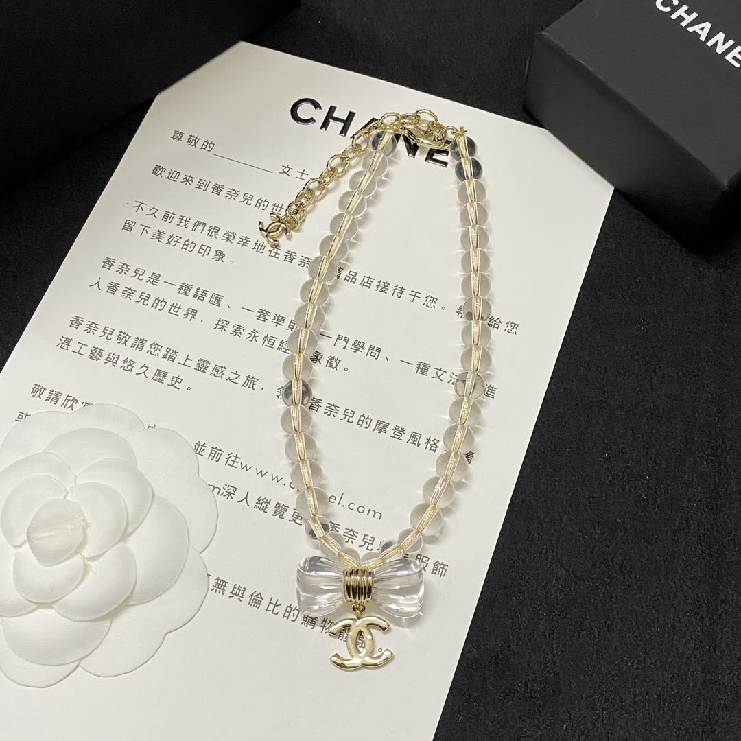 Chanel Crystal Beaded Necklace with Bow and Logo Pendant