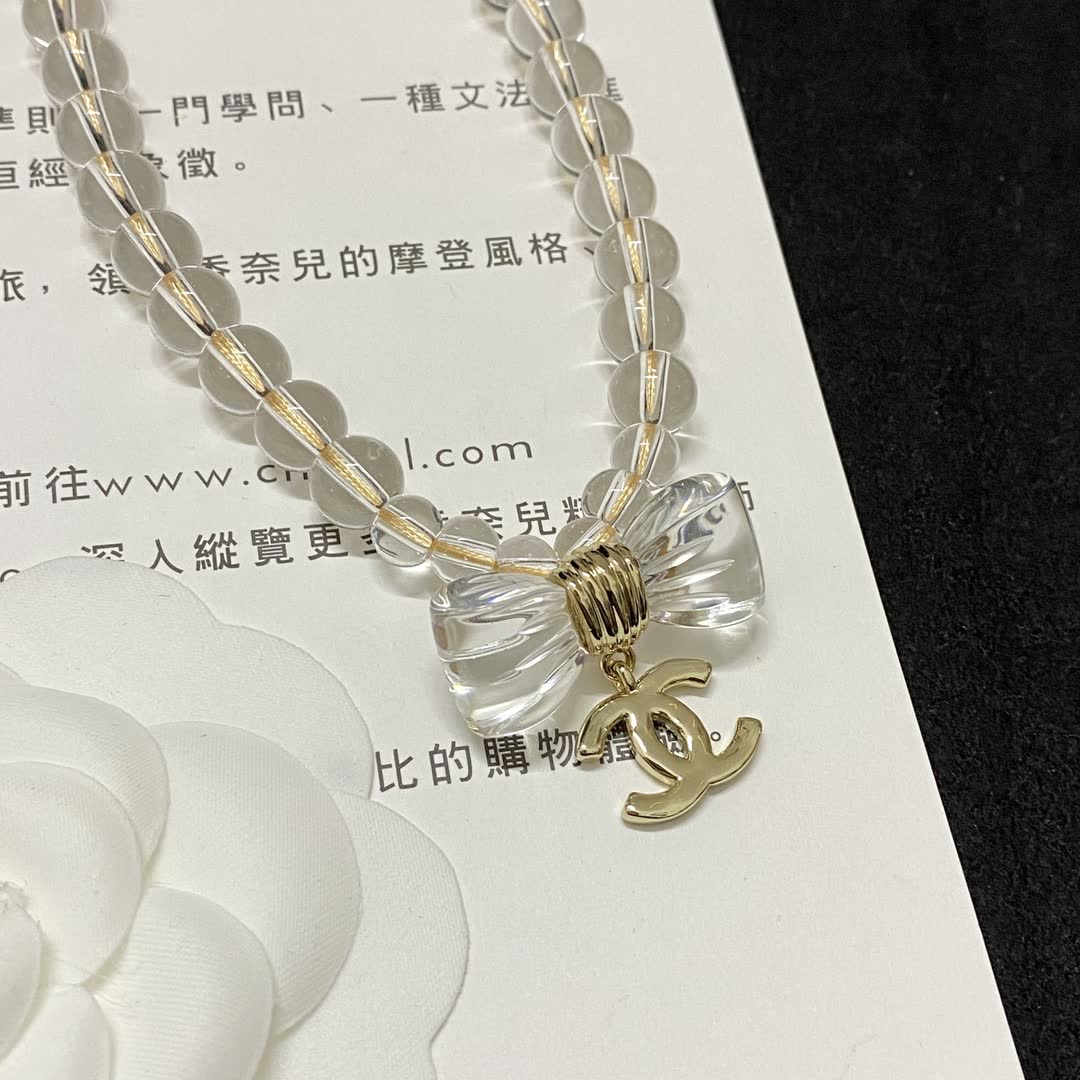 Chanel Crystal Beaded Necklace with Bow and Logo Pendant