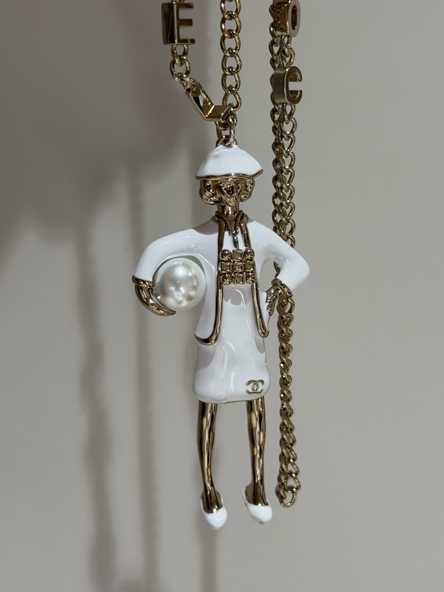 Chanel Gold Tone White Enamel Figurine Necklace
