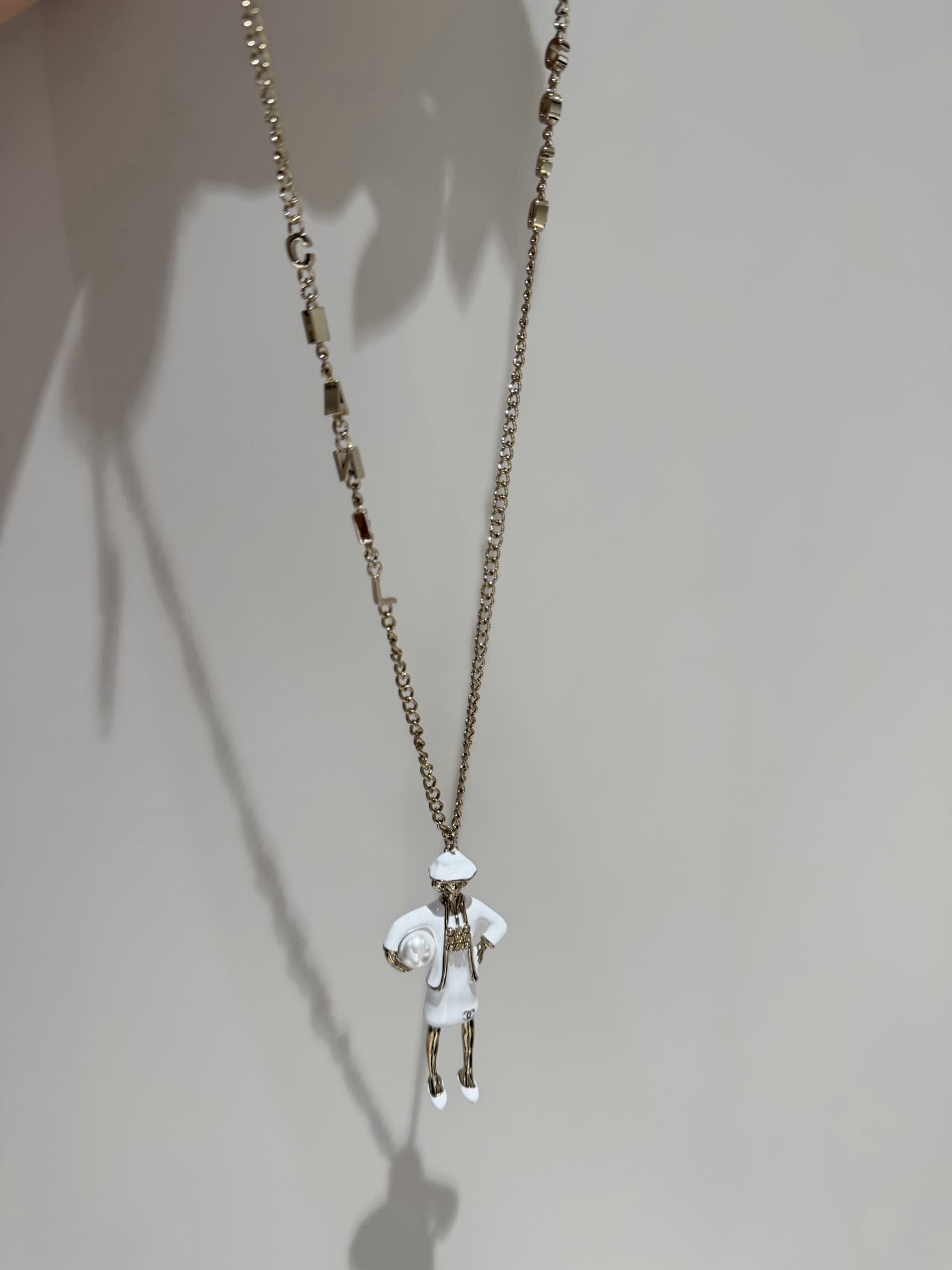Chanel Gold Tone White Enamel Figurine Necklace