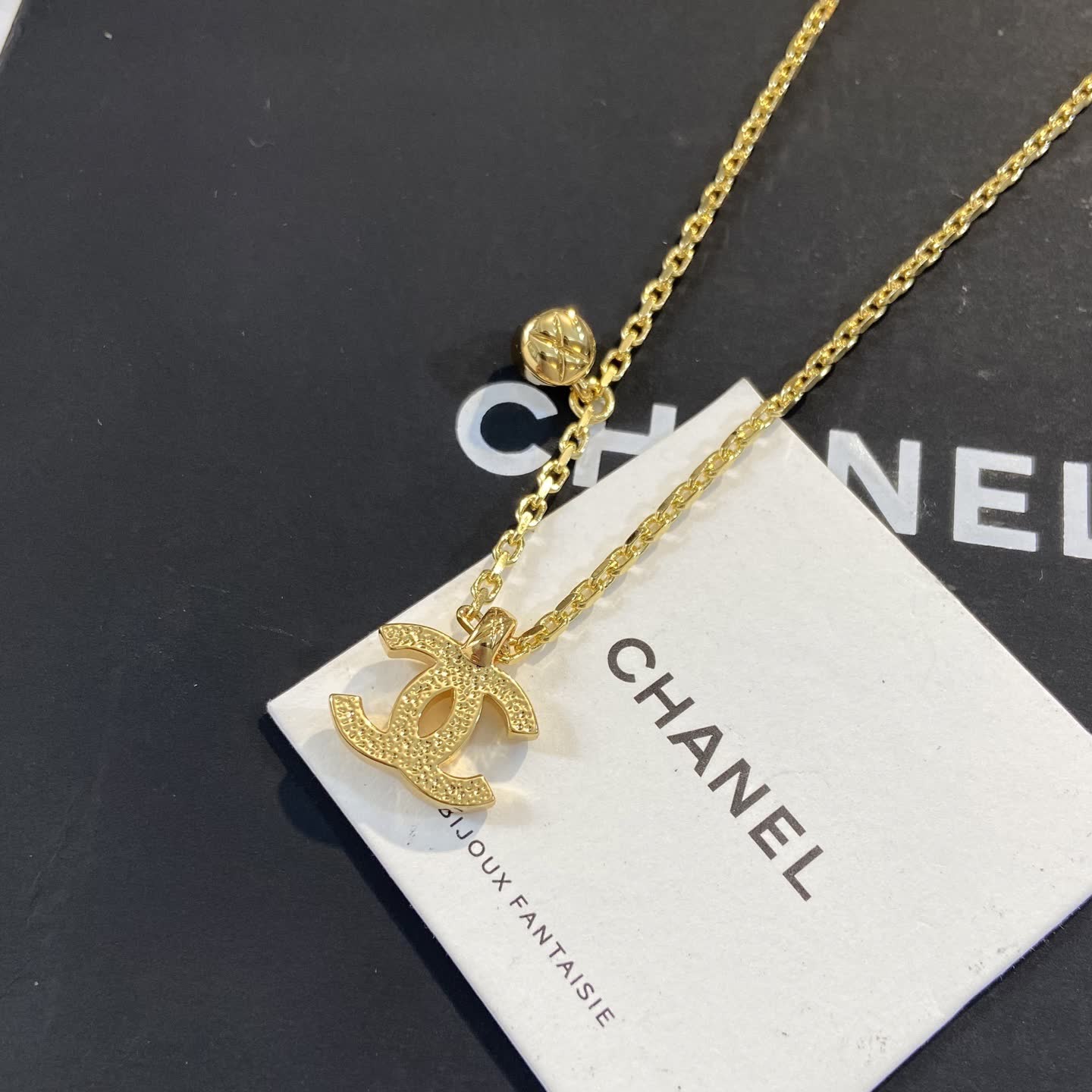 Chanel CC Logo Gold Tone Necklace with Crystal Charm