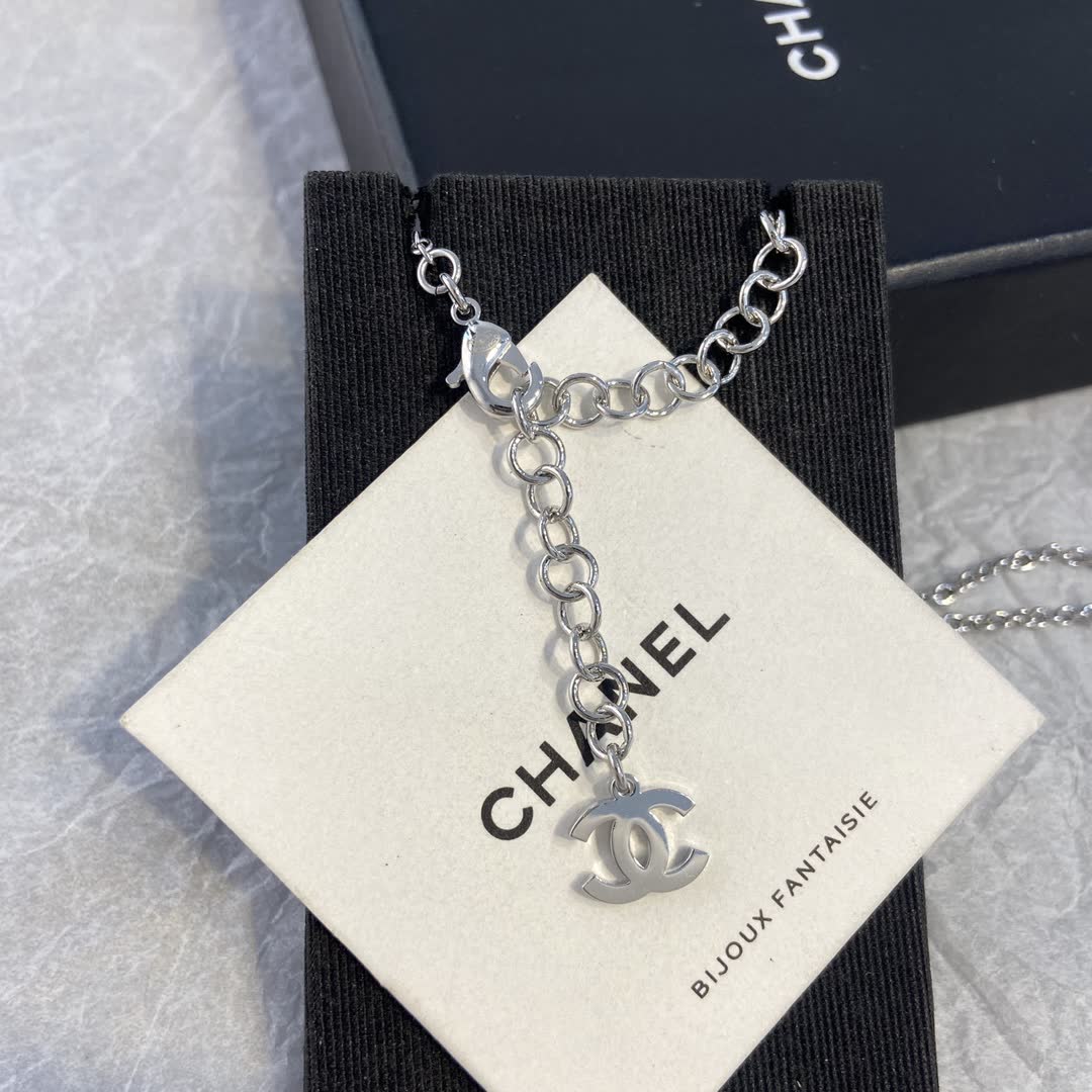 Chanel Silver Necklace with Blue Stone Pendant