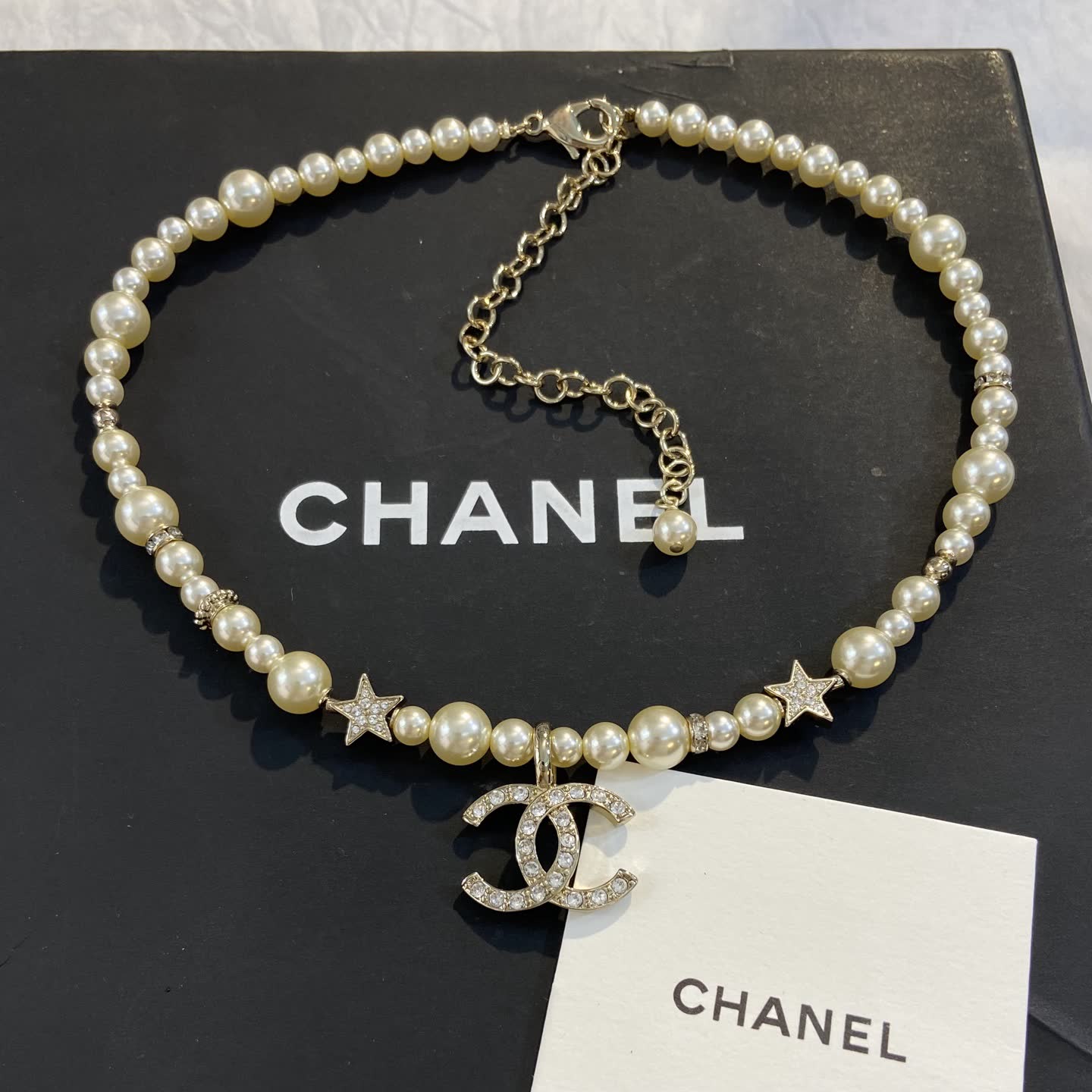 Chanel Pearl Necklace with CC Logo and Stars