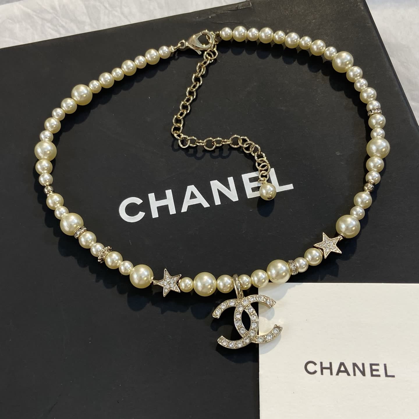 Chanel Pearl Necklace with CC Logo and Stars
