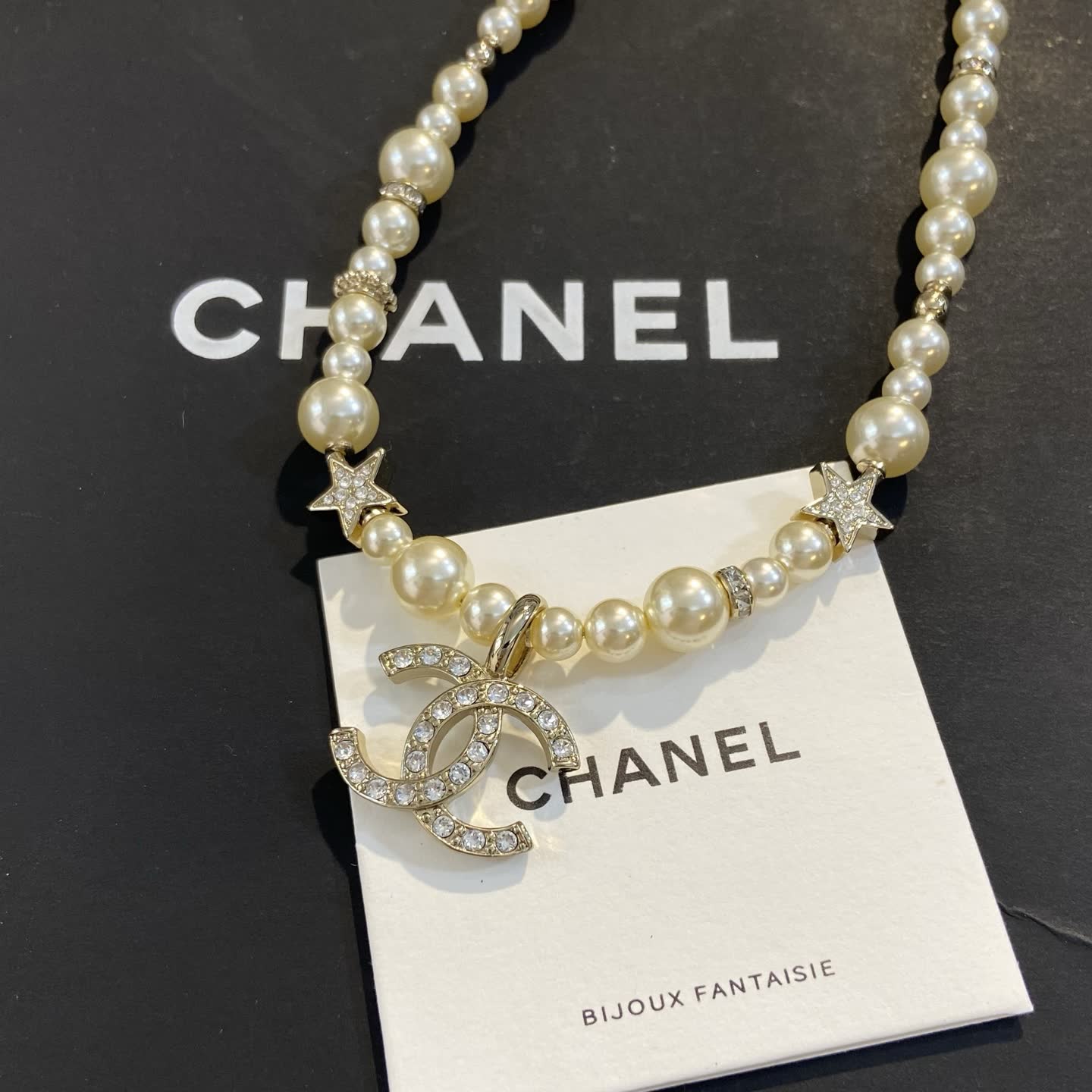 Chanel Pearl Necklace with CC Logo and Stars