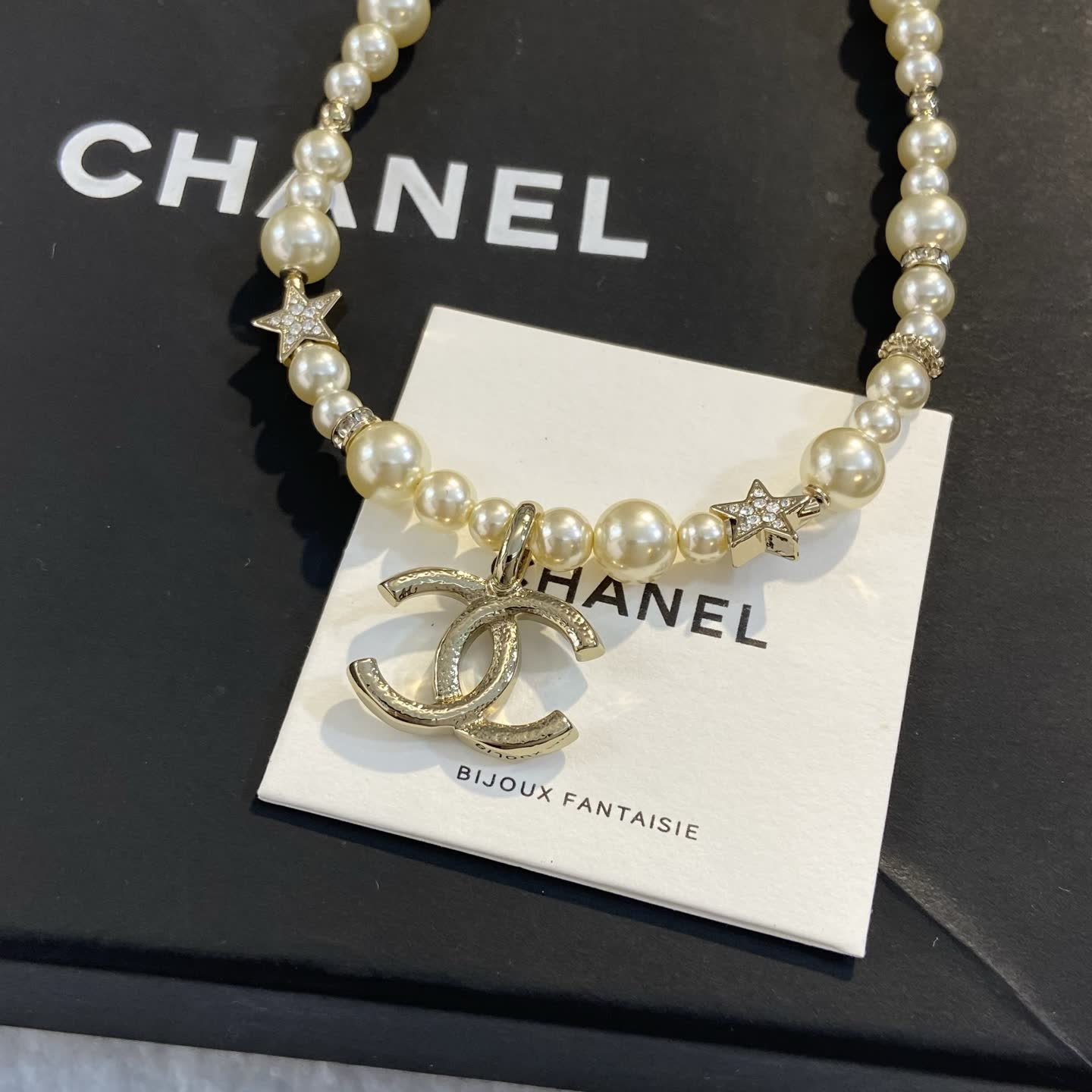 Chanel Pearl Necklace with CC Logo and Stars