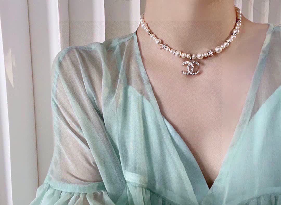 Chanel Pearl Necklace with CC Logo and Stars