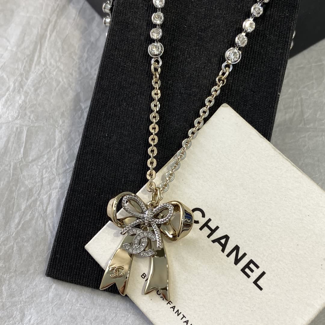 Chanel Gold Tone Crystal Bow Necklace