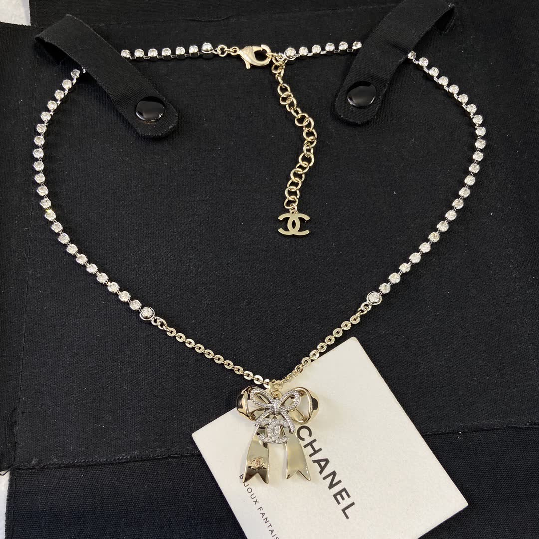 Chanel Gold Tone Crystal Bow Necklace