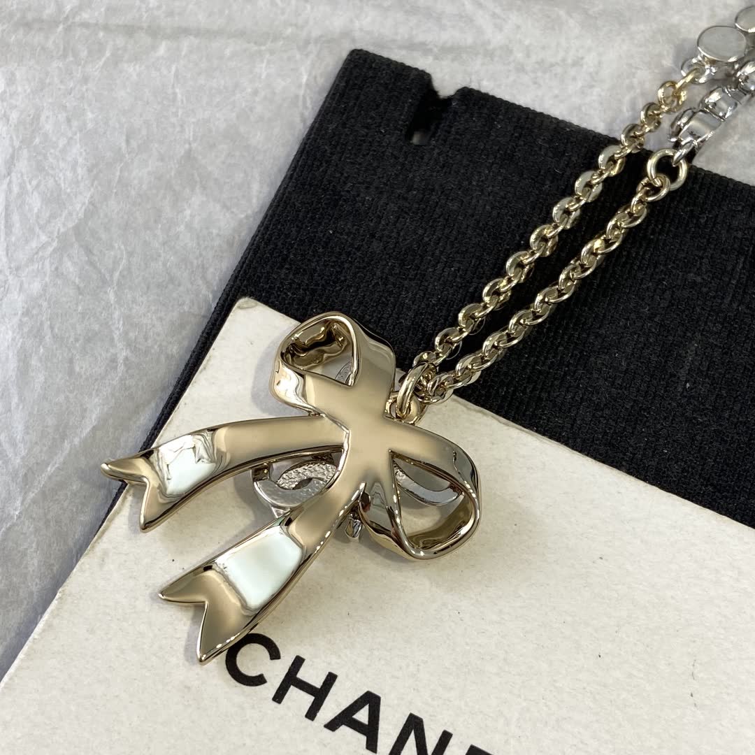 Chanel Gold Tone Crystal Bow Necklace