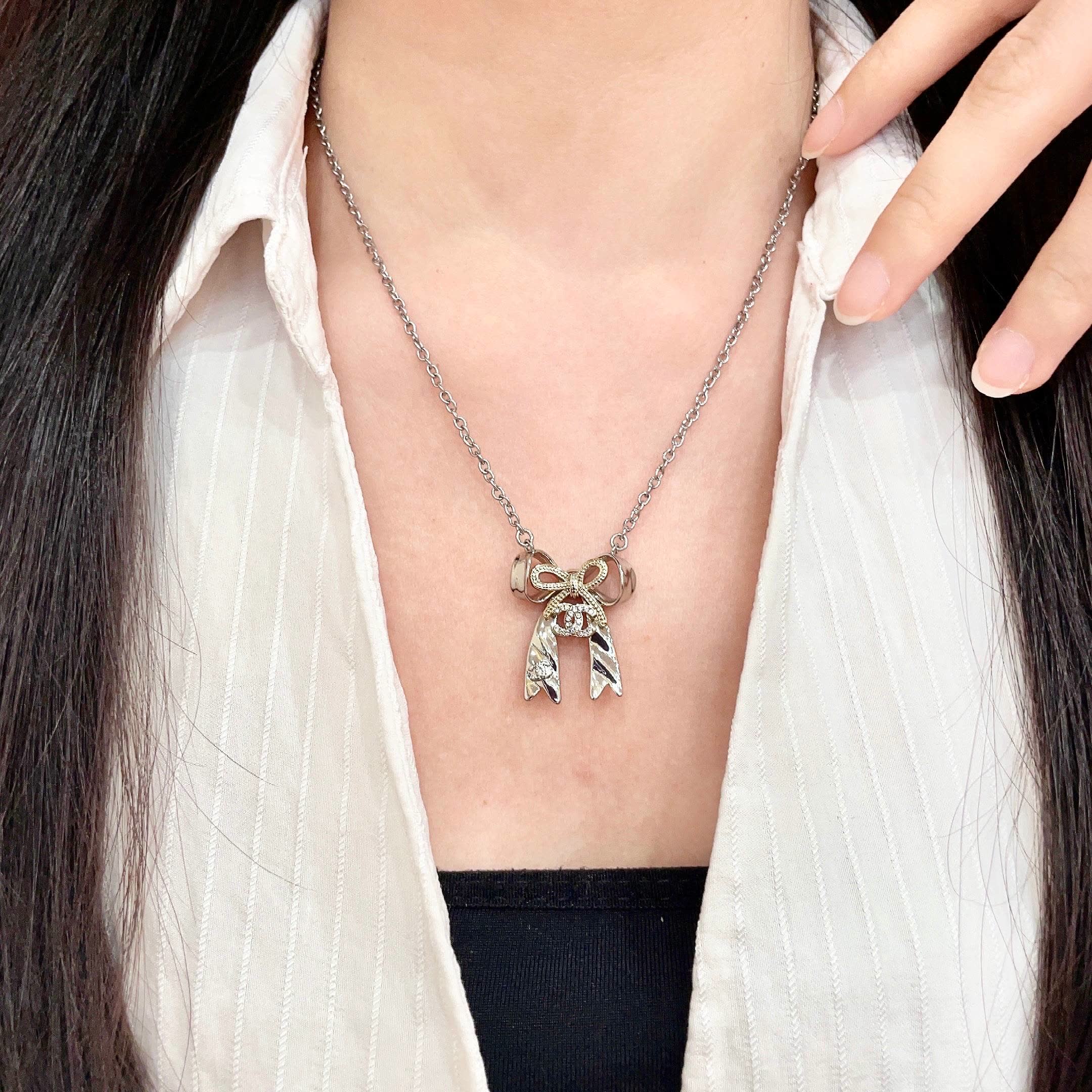 Chanel Silver Bow Tie Pendant Necklace