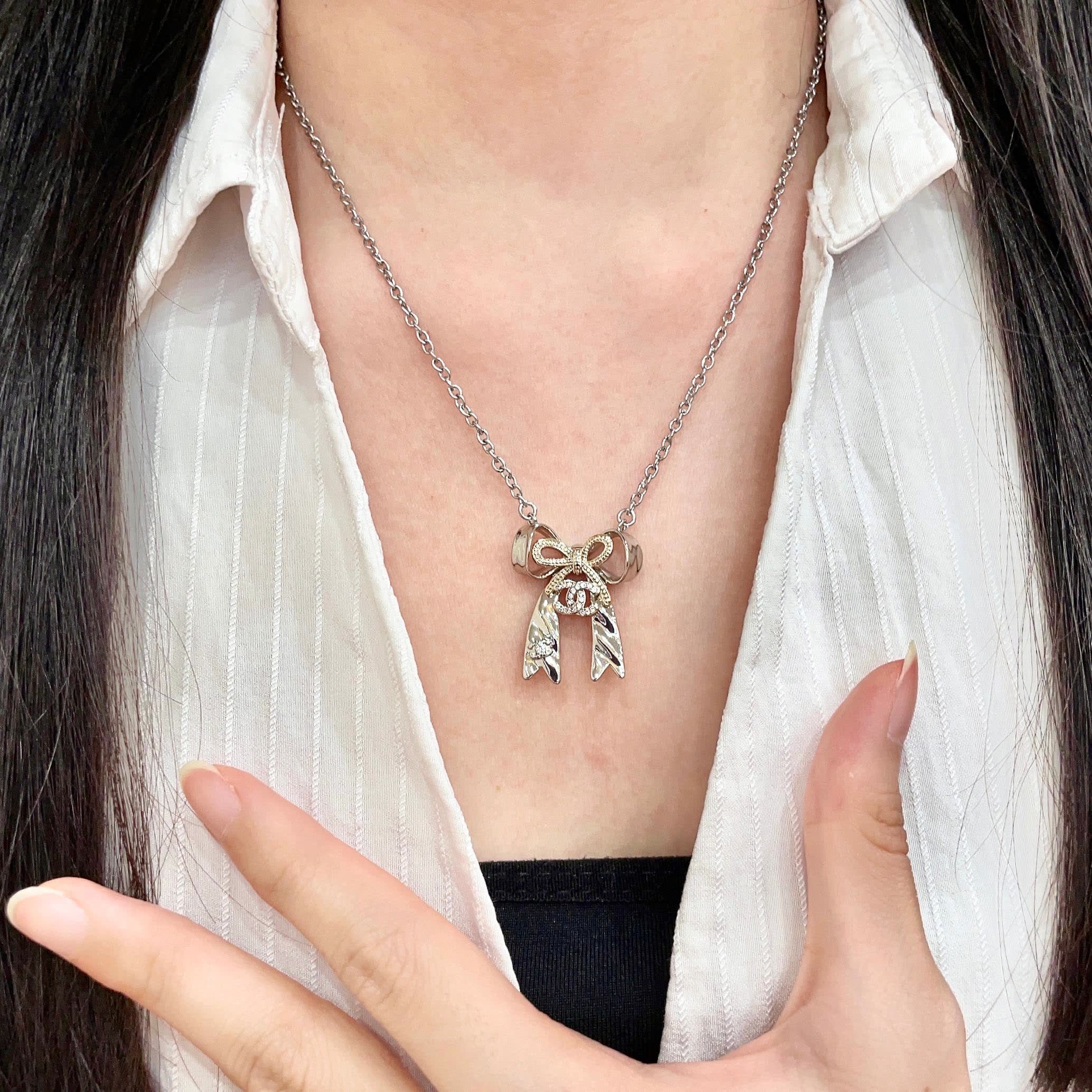 Chanel Silver Bow Tie Pendant Necklace