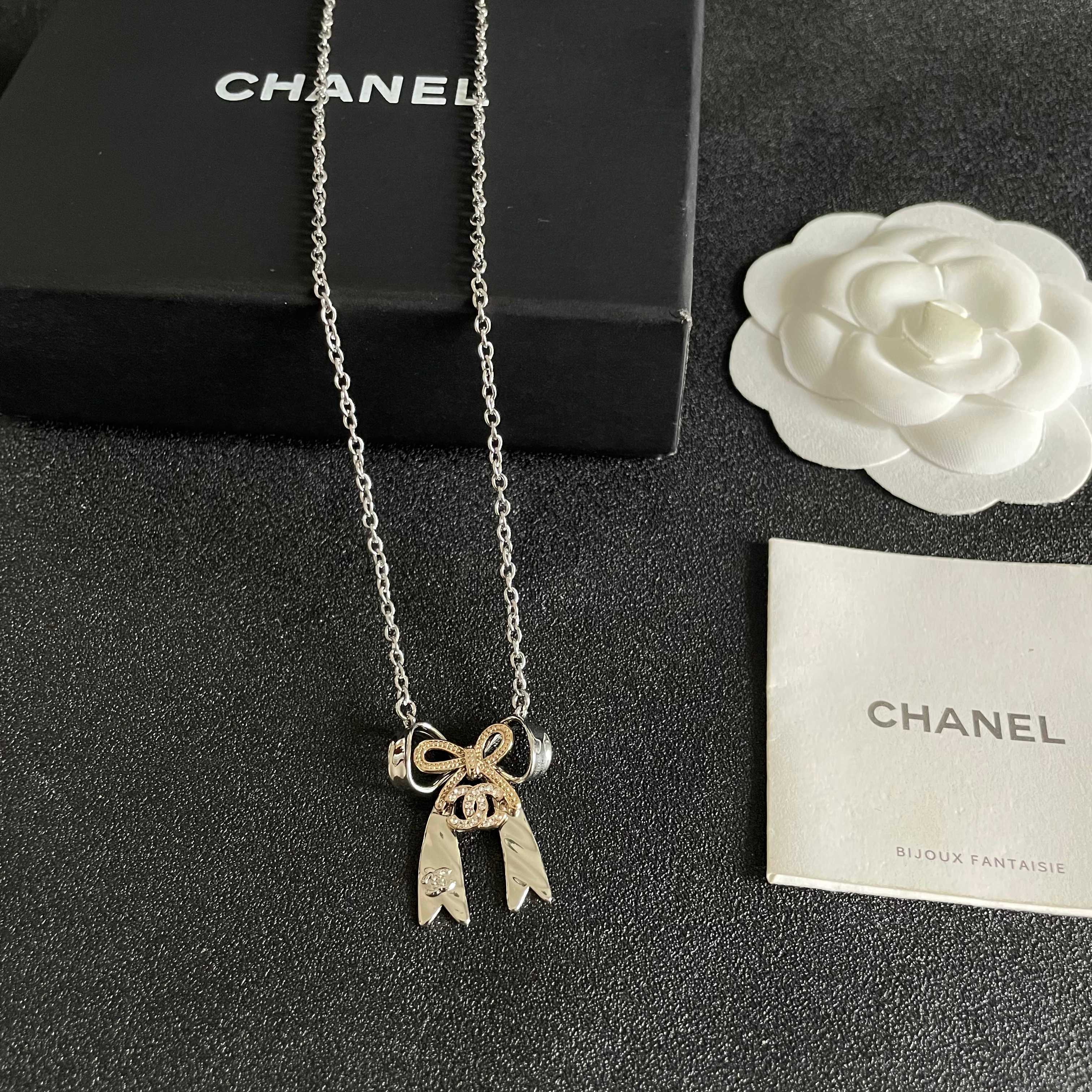 Chanel Silver Bow Tie Pendant Necklace