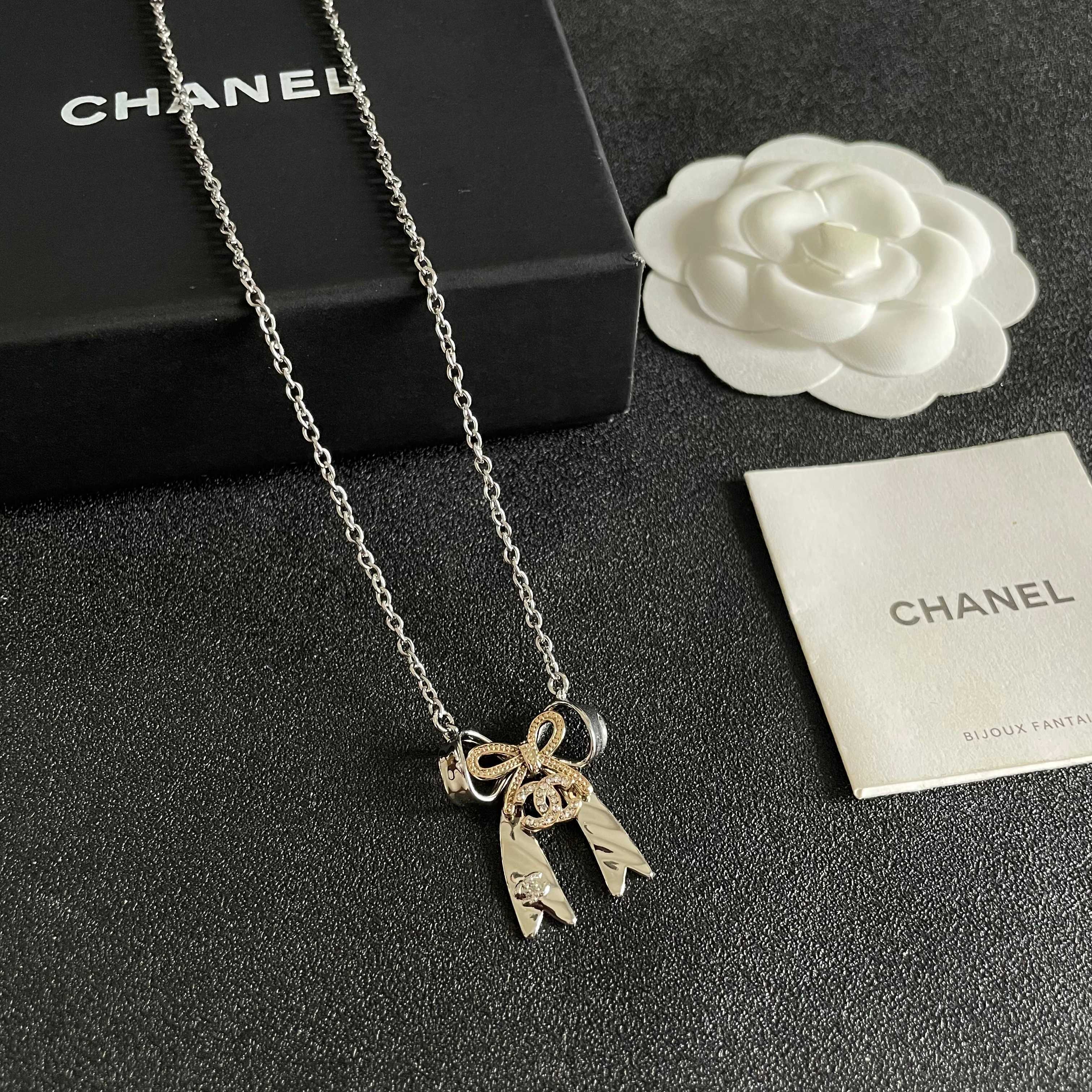 Chanel Silver Bow Tie Pendant Necklace