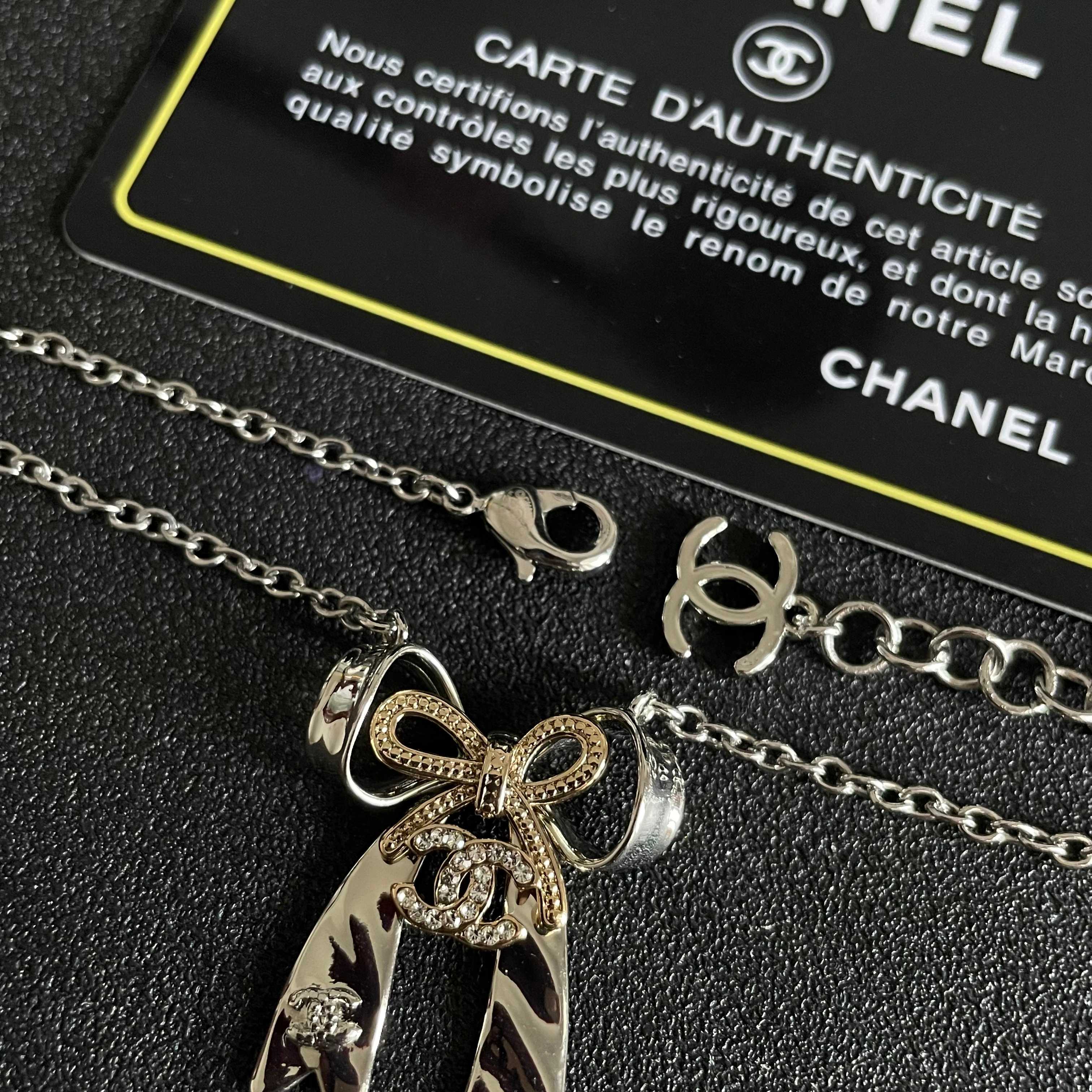 Chanel Silver Bow Tie Pendant Necklace