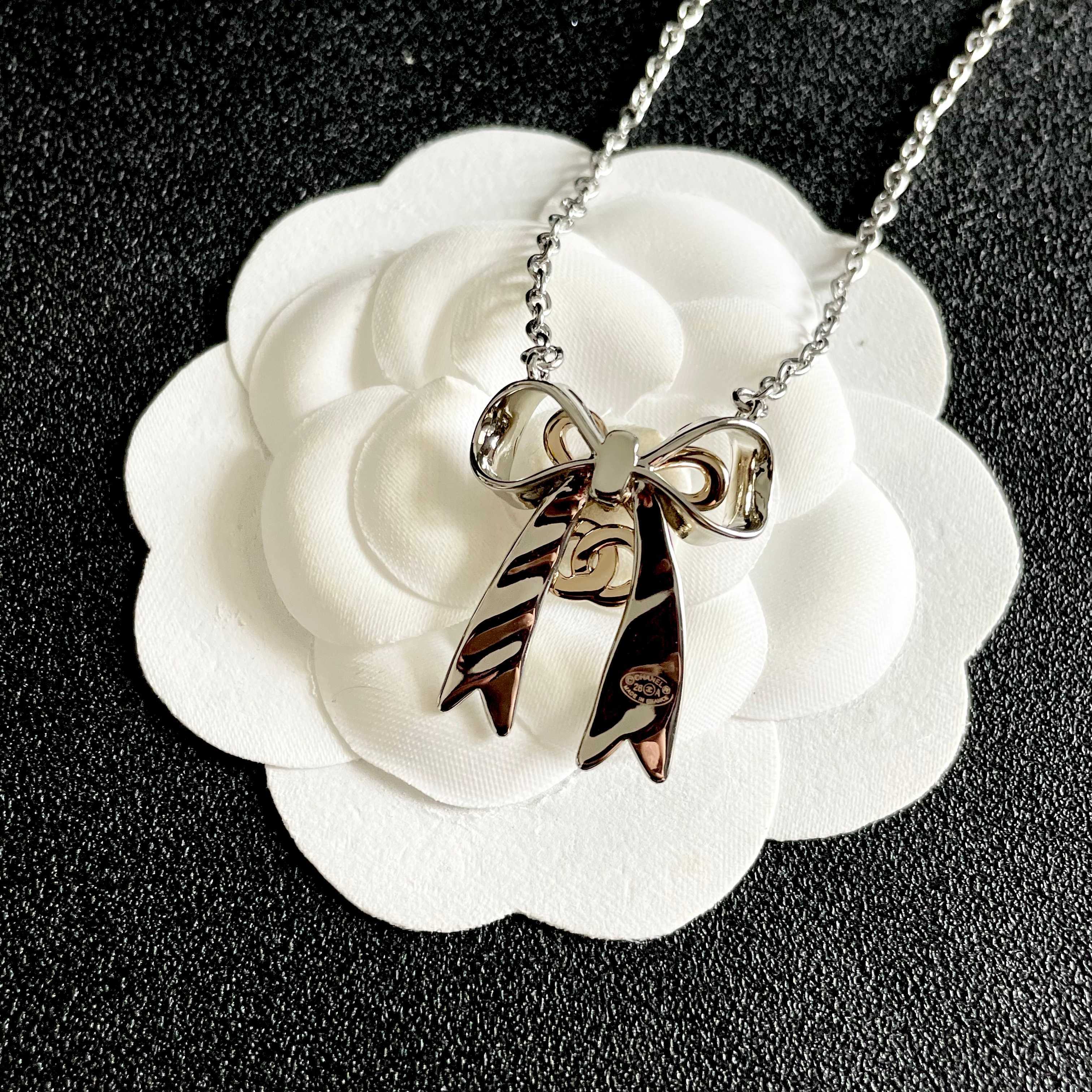 Chanel Silver Bow Tie Pendant Necklace