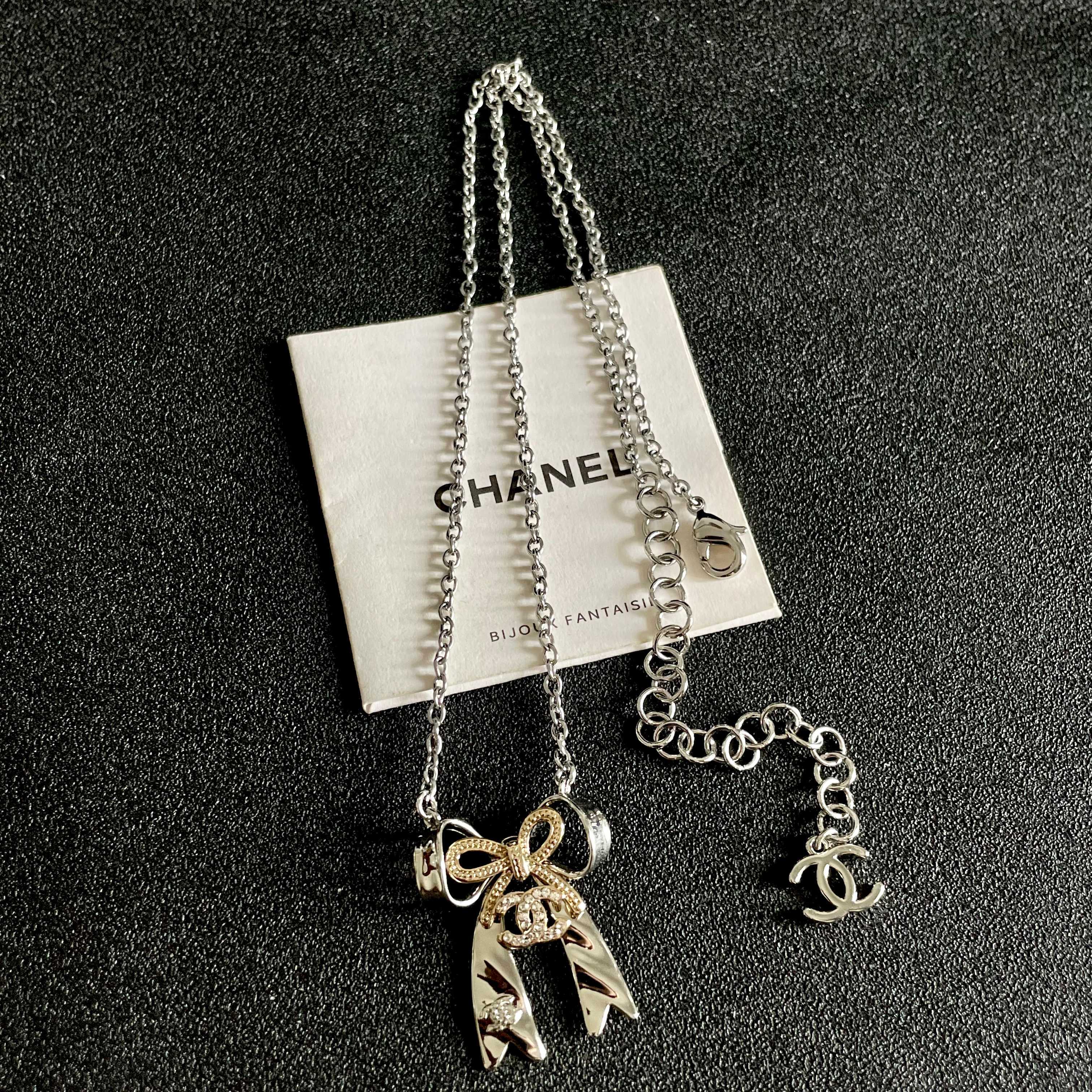 Chanel Silver Bow Tie Pendant Necklace