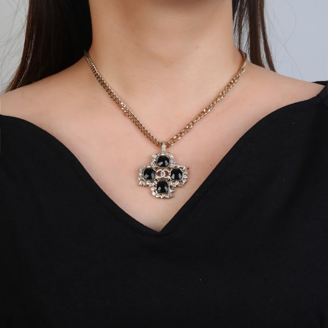 Chanel Elegant Gold and Black Gemstone Pendant Necklace