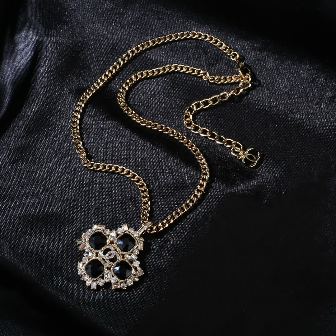 Chanel Elegant Gold and Black Gemstone Pendant Necklace
