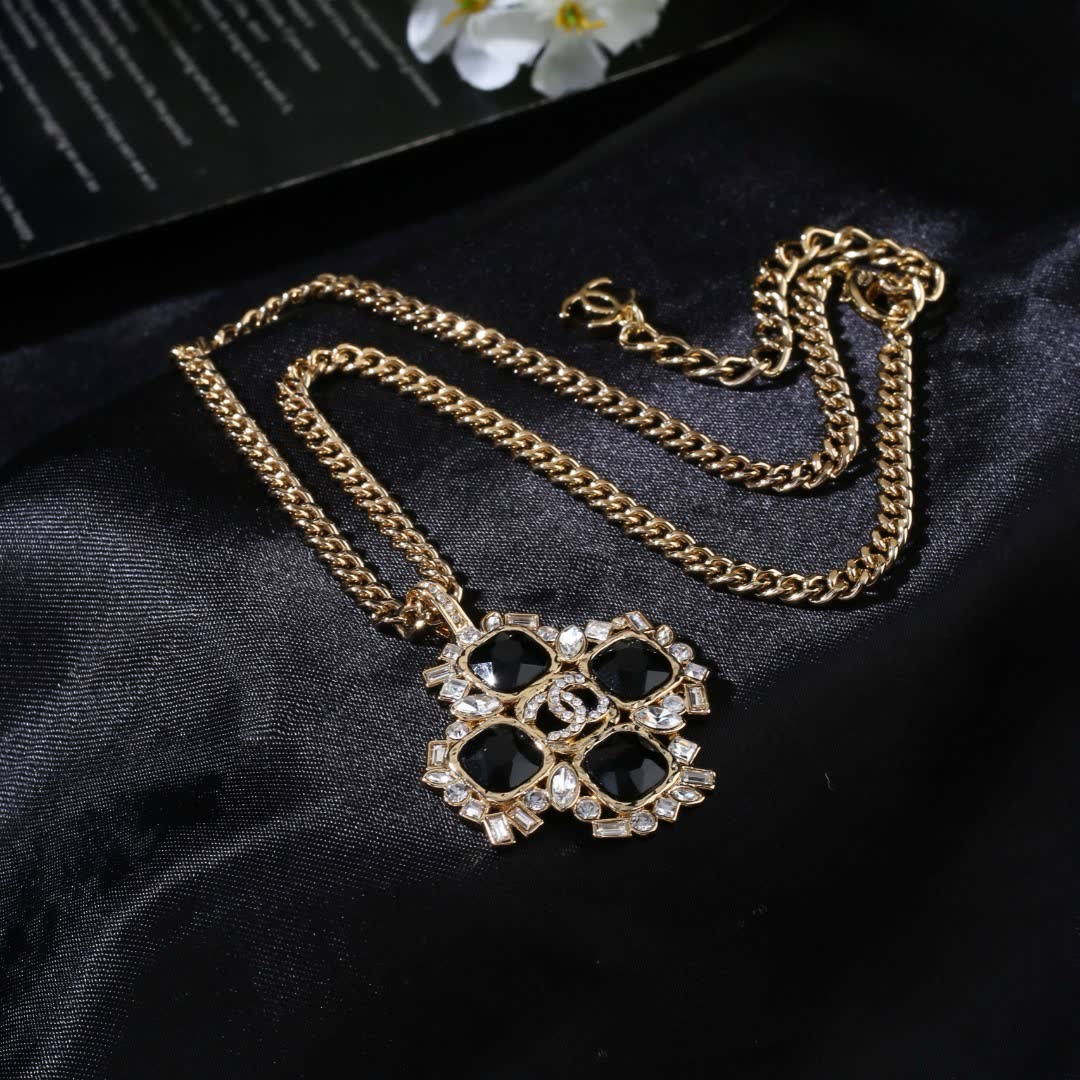 Chanel Elegant Gold and Black Gemstone Pendant Necklace