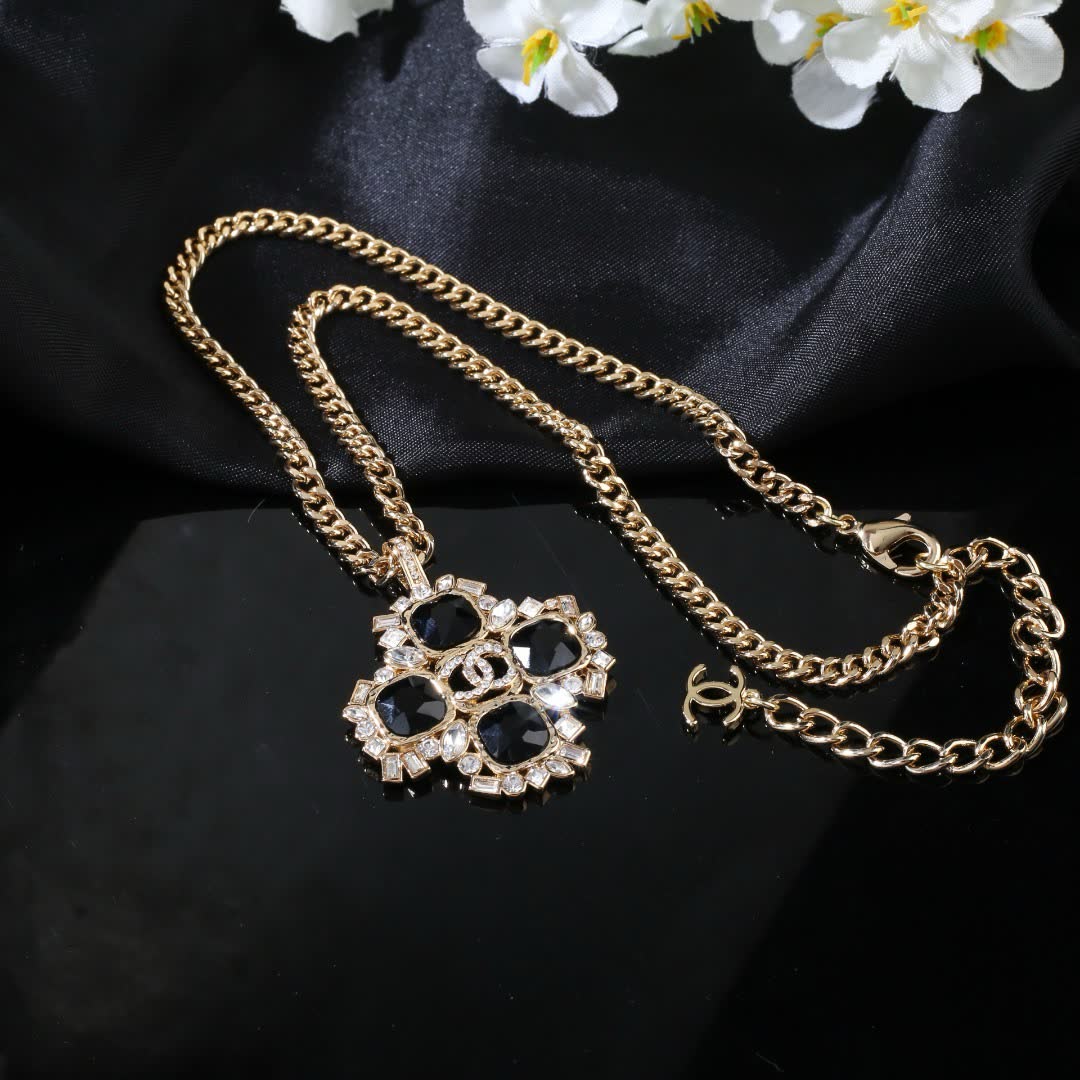 Chanel Elegant Gold and Black Gemstone Pendant Necklace
