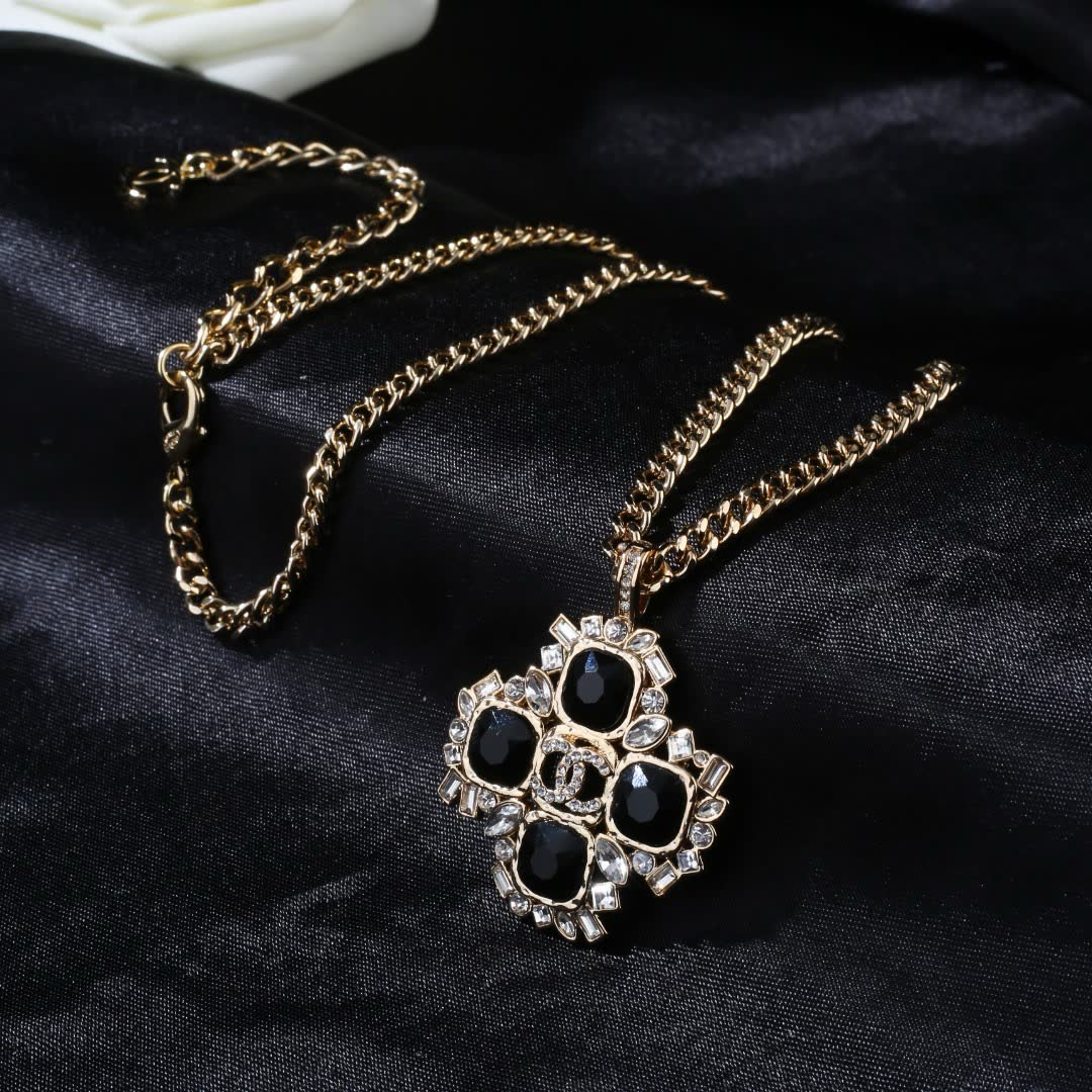 Chanel Elegant Gold and Black Gemstone Pendant Necklace