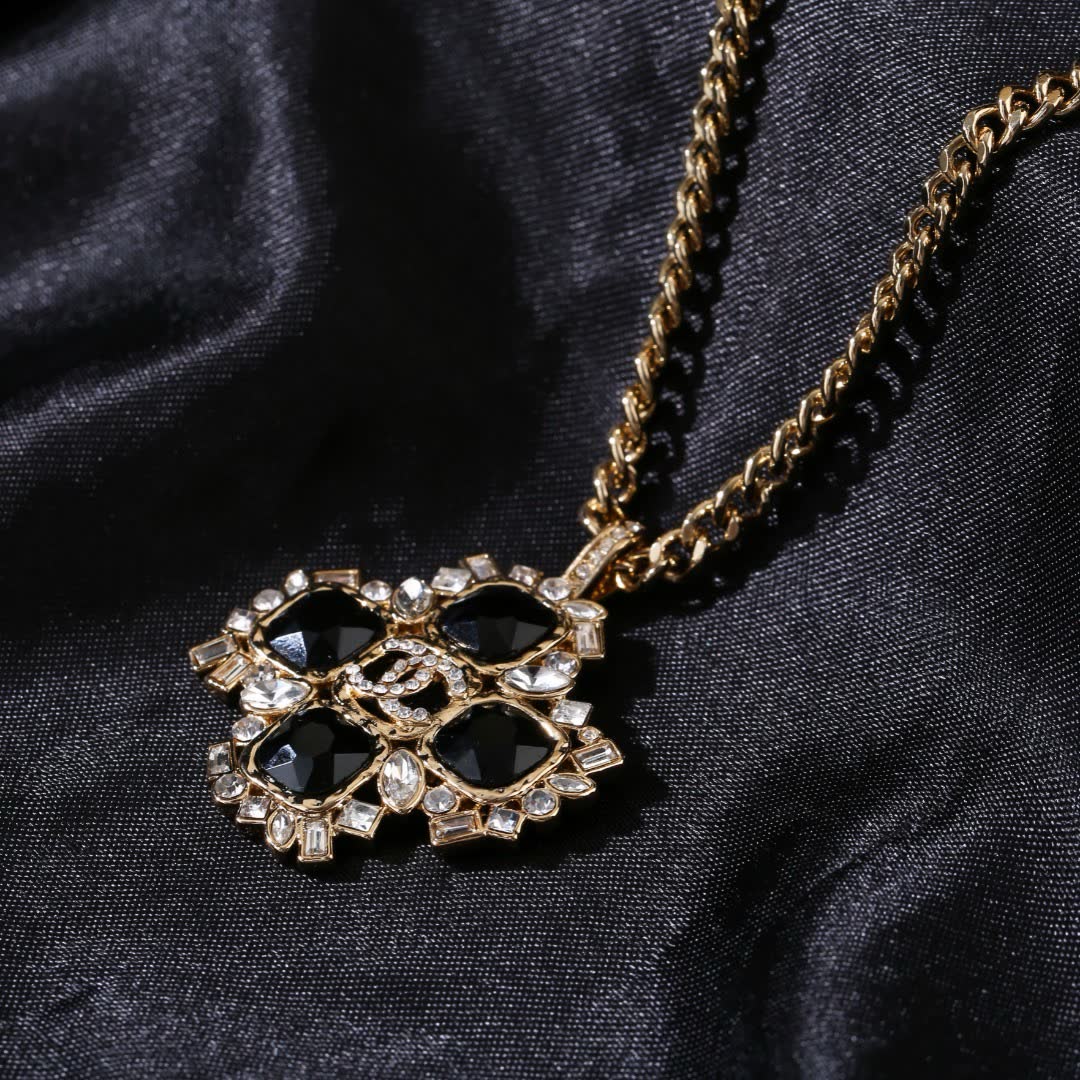 Chanel Elegant Gold and Black Gemstone Pendant Necklace