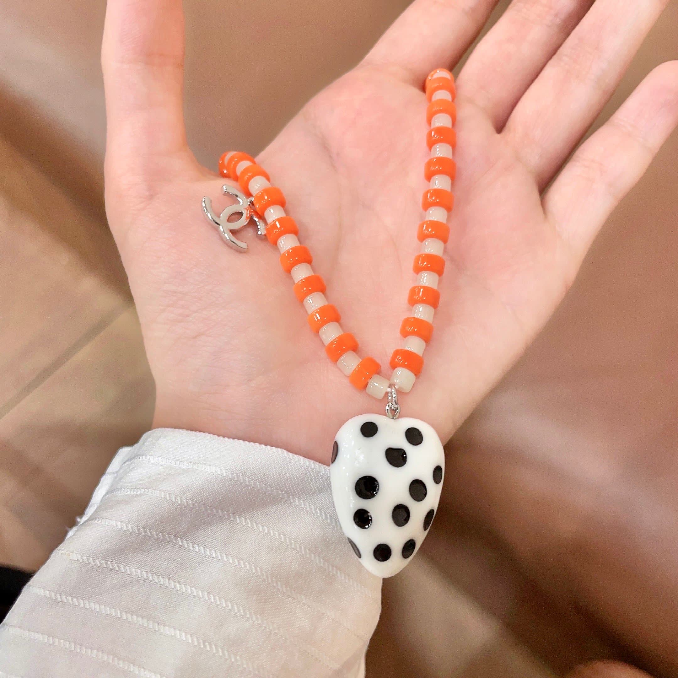 Chanel Orange Beaded Necklace with Heart Pendant