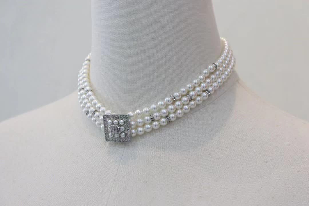 Chanel Elegant Triple Strand Pearl Necklace with Diamond Clasp