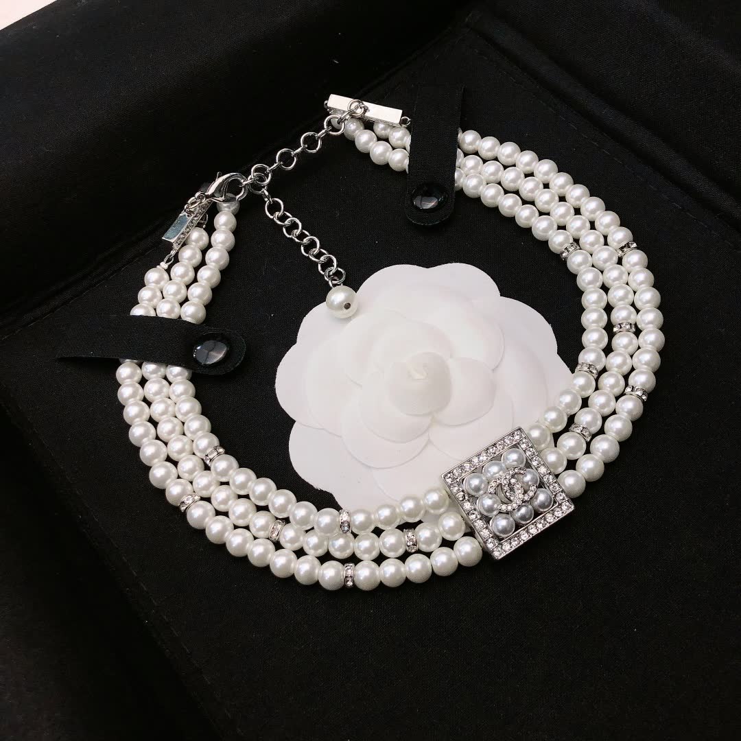 Chanel Elegant Triple Strand Pearl Necklace with Diamond Clasp
