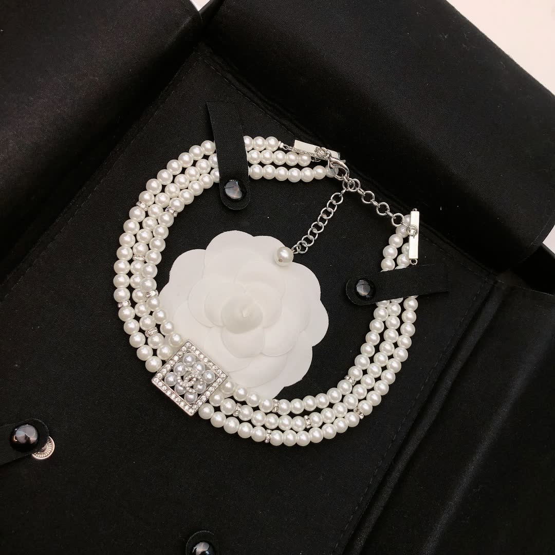 Chanel Elegant Triple Strand Pearl Necklace with Diamond Clasp