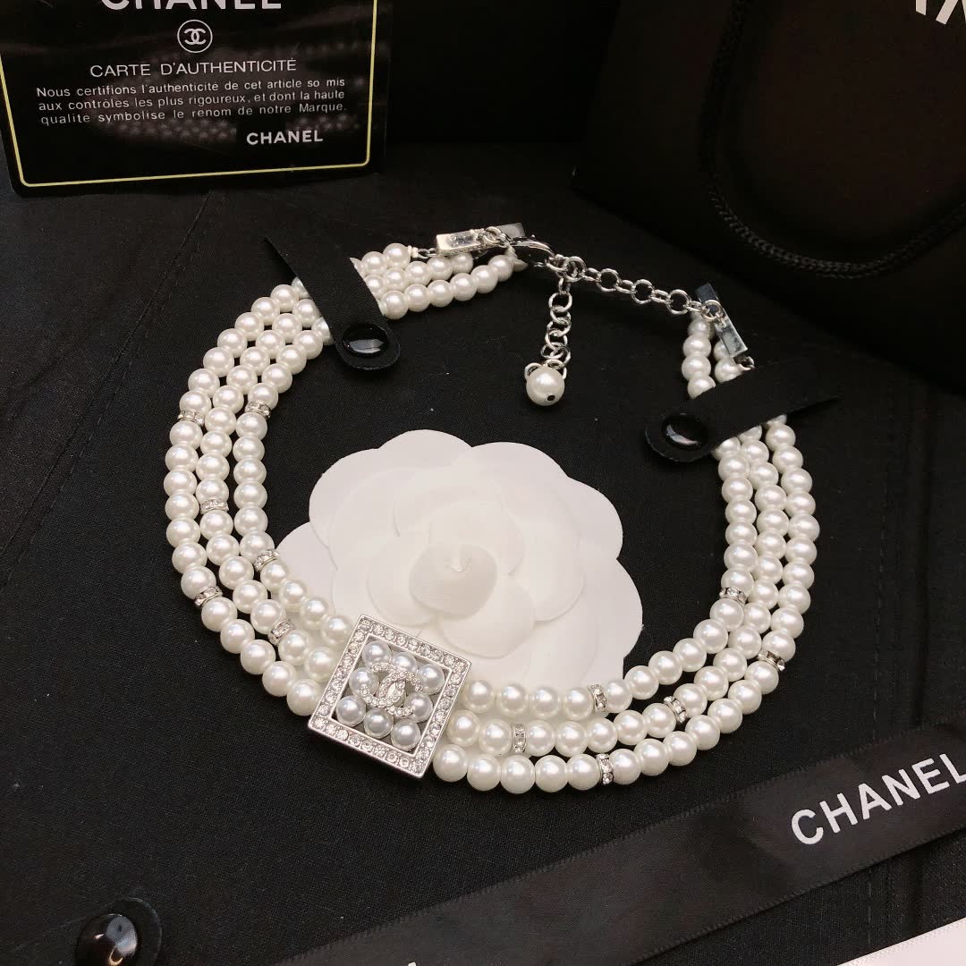 Chanel Elegant Triple Strand Pearl Necklace with Diamond Clasp