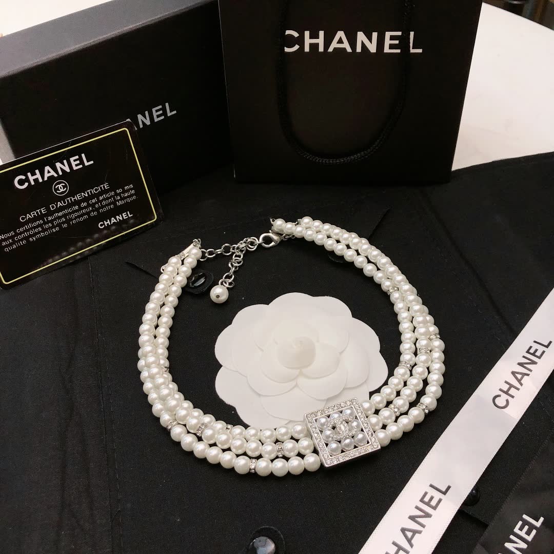 Chanel Elegant Triple Strand Pearl Necklace with Diamond Clasp