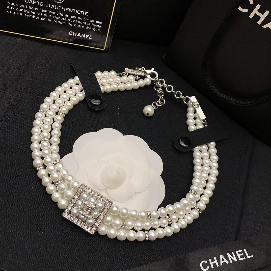 Chanel Elegant Triple Strand Pearl Necklace with Diamond Clasp
