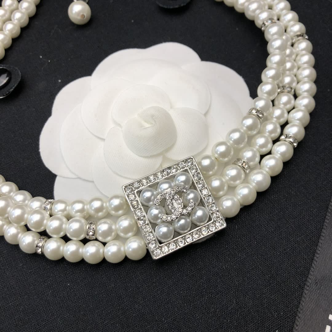 Chanel Elegant Triple Strand Pearl Necklace with Diamond Clasp