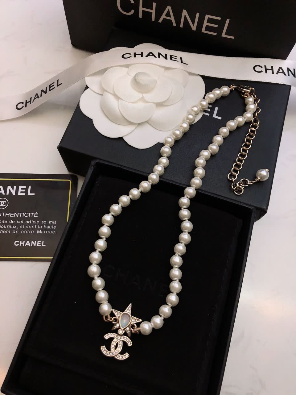 Chanel Pearl Necklace with CC Logo and Star Design