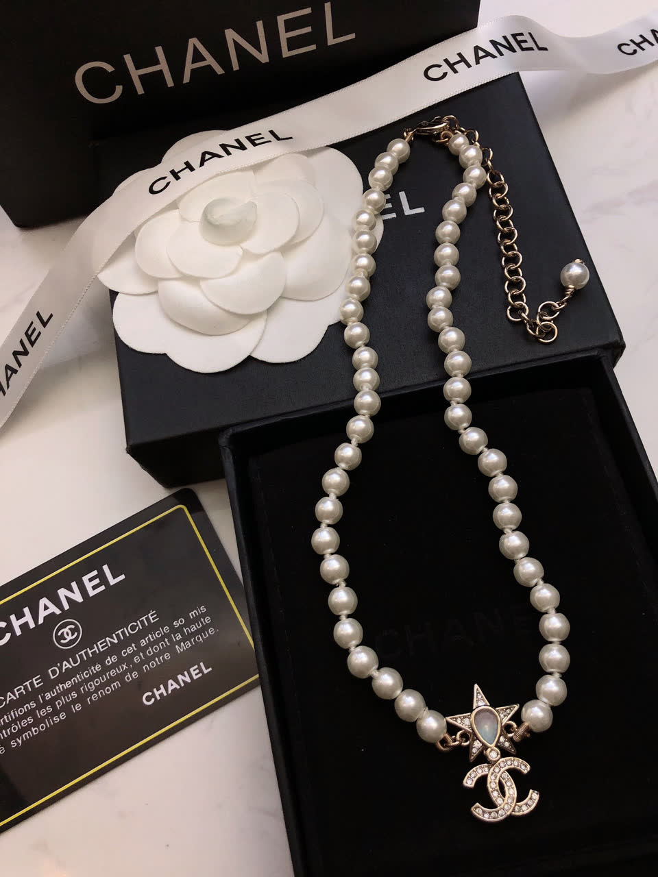 Chanel Pearl Necklace with CC Logo and Star Design