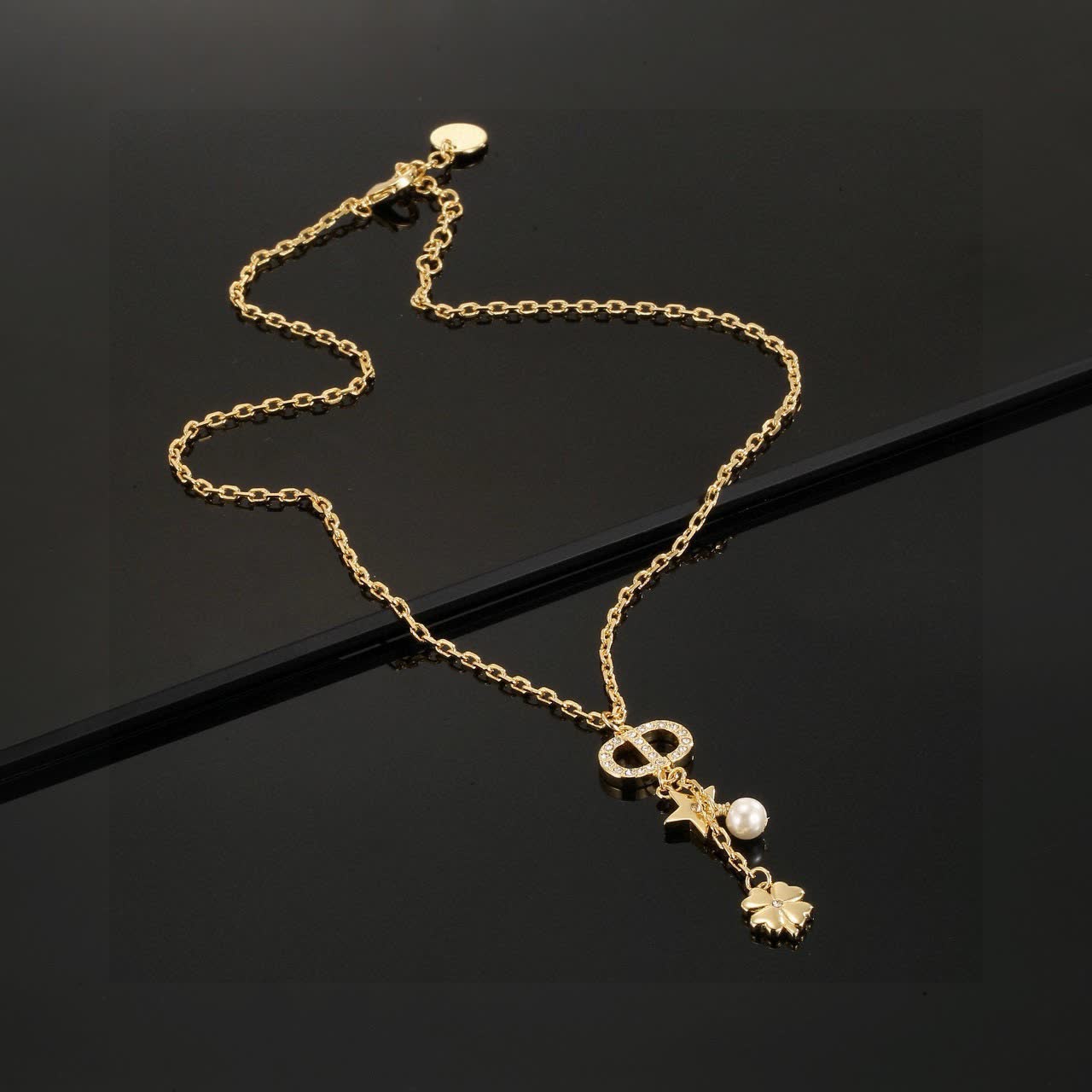 Chanel Gold-tone Necklace with Pearl and Clover Charm Chanel Gold-tone Necklace with Pearl and Clover Charm