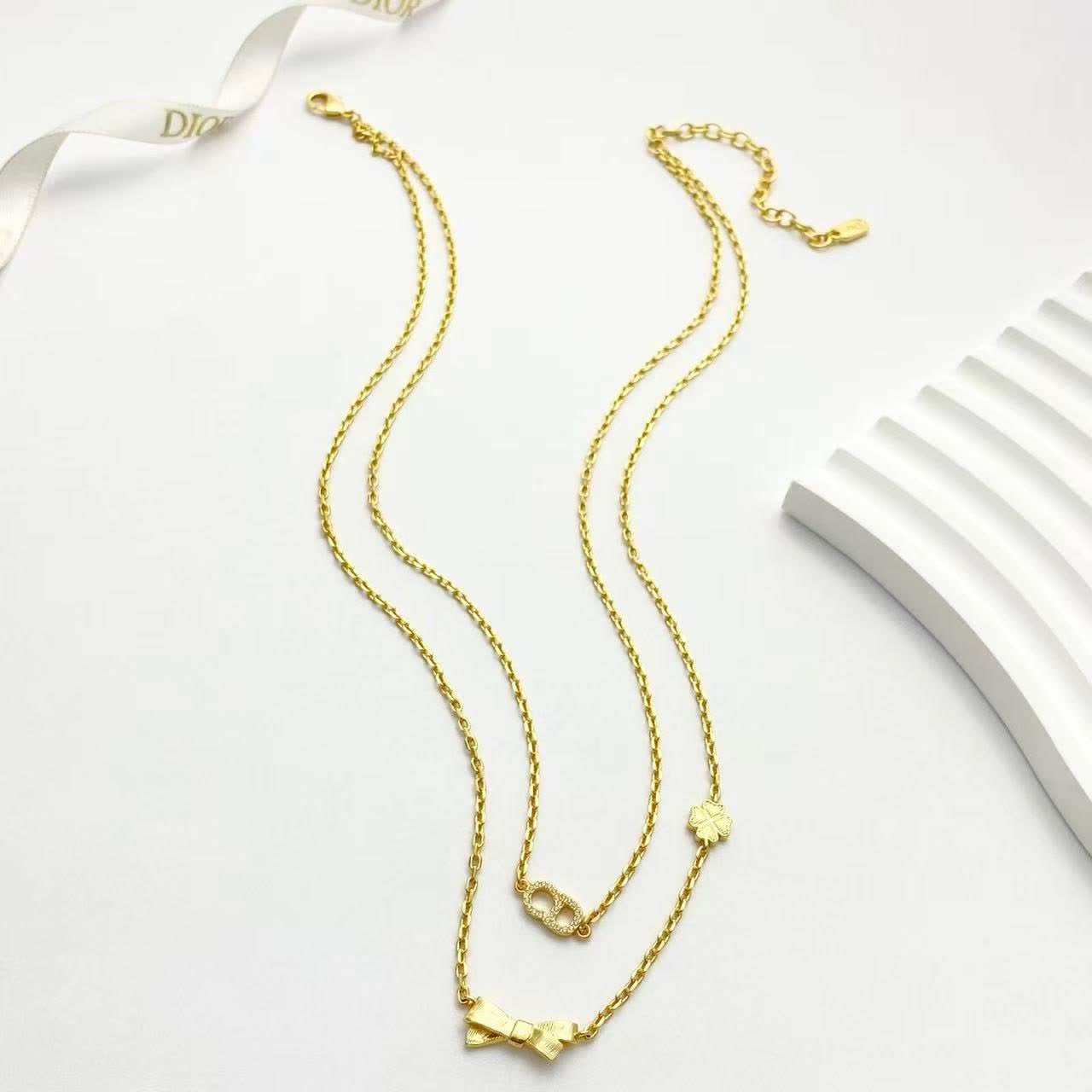 Dior Gold-Tone Necklace with Bow and Clover Charms Dior Gold-Tone Necklace with Bow and Clover Charms
