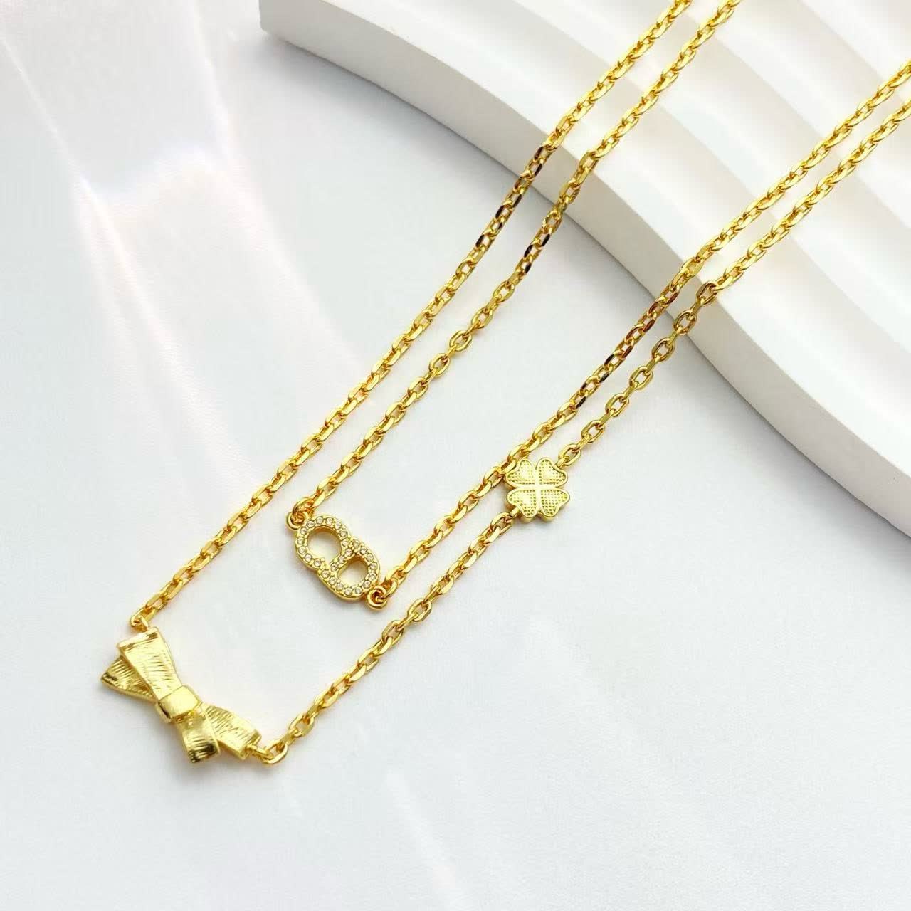 Dior Gold-Tone Necklace with Bow and Clover Charms
