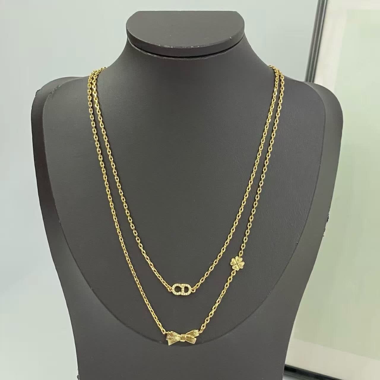 Dior Gold-Tone Necklace with Bow and Clover Charms