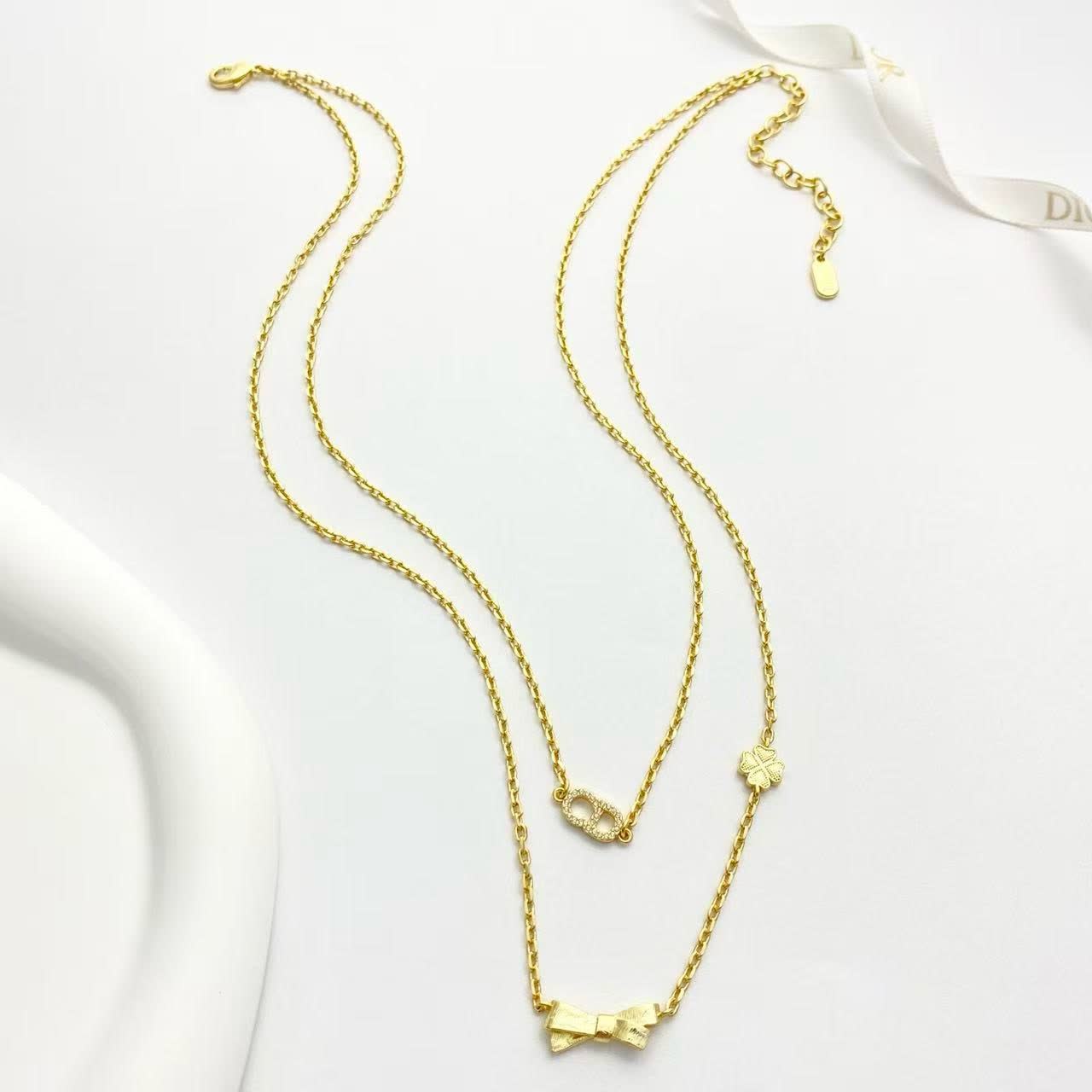 Dior Gold-Tone Necklace with Bow and Clover Charms